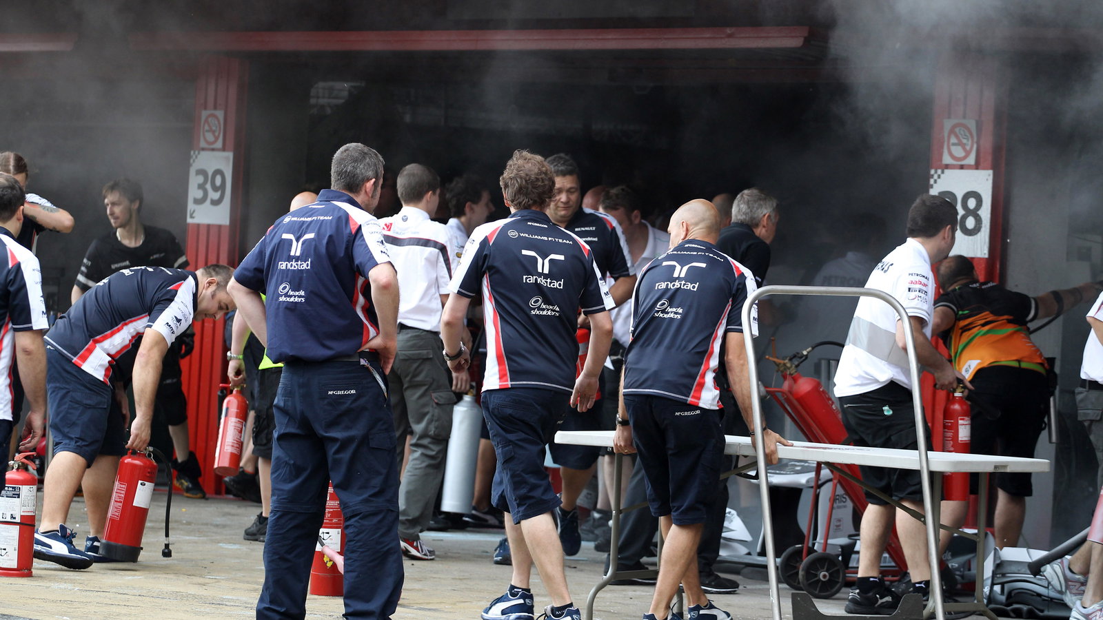 13.05.2012- A fire in the Williams pit garage after the celebrations is tended to by members of all