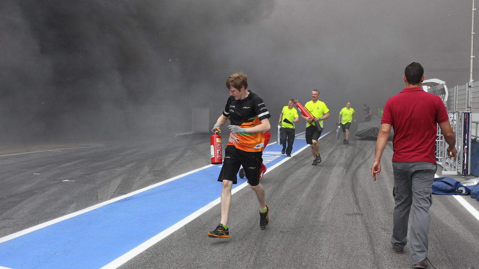 13.05.2012- A fire in the Williams pit garage after the celebrations is tended to by members of all