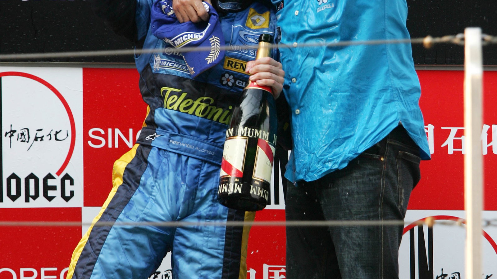Chinese GP race winner Fernando Alonso and Flavio Briatore celebrate helping Renault to the construc