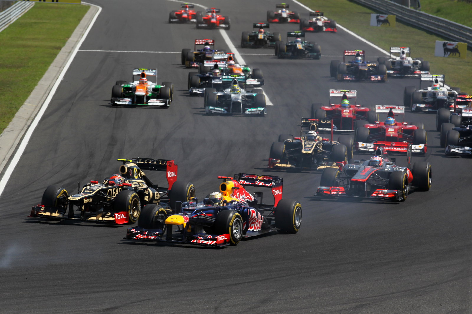 29.07.2012- Race, Start of the race, Romain Grosjean (FRA) Lotus F1 Team E20 and Sebastian Vettel (G