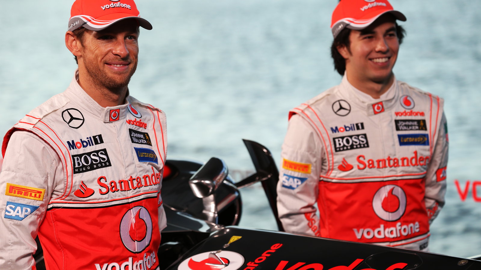 (L to R): Jenson Button (GBR) McLaren with team mate Sergio Perez (MEX) McLaren.31.01.2013. McLaren