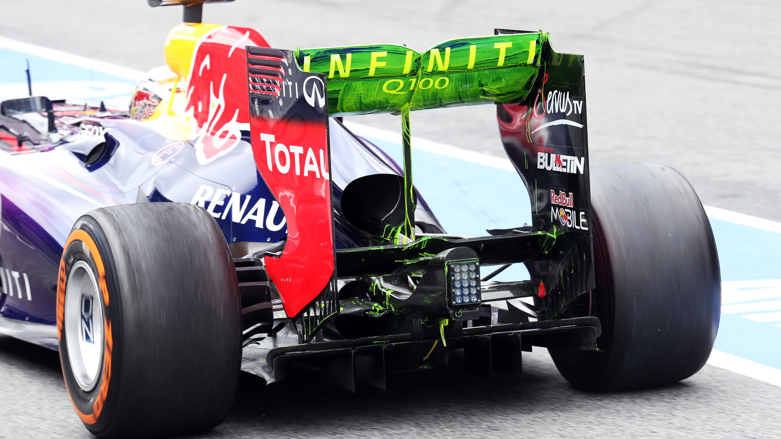 Sebastian Vettel (GER) Red Bull Racing RB9 running flow-vis paint on the rear wing and rear diffuser
