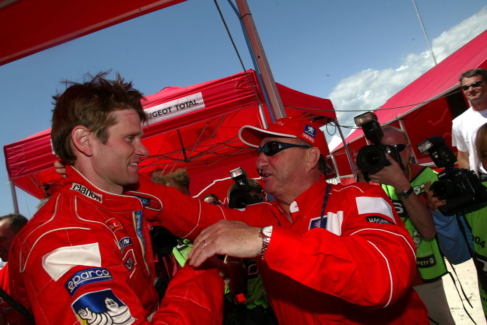 Jean-Pierre Nicolas, Peugeot Sport director, congratulates Marcus Gronholm after his win in Cyprus