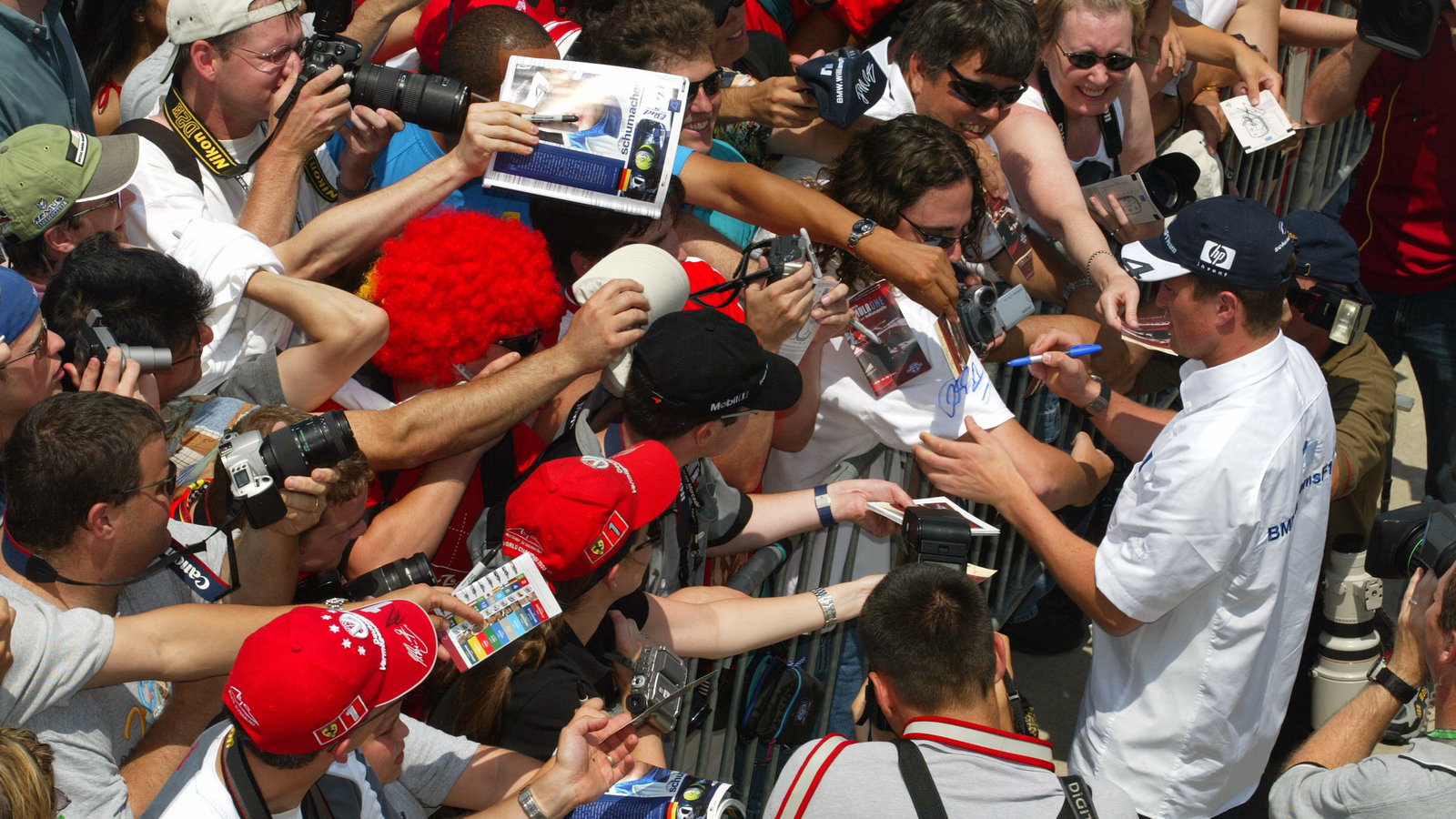 Ralf Schumacher, BMW Williams F1 signs autographs for the fans at the 2004 US GP