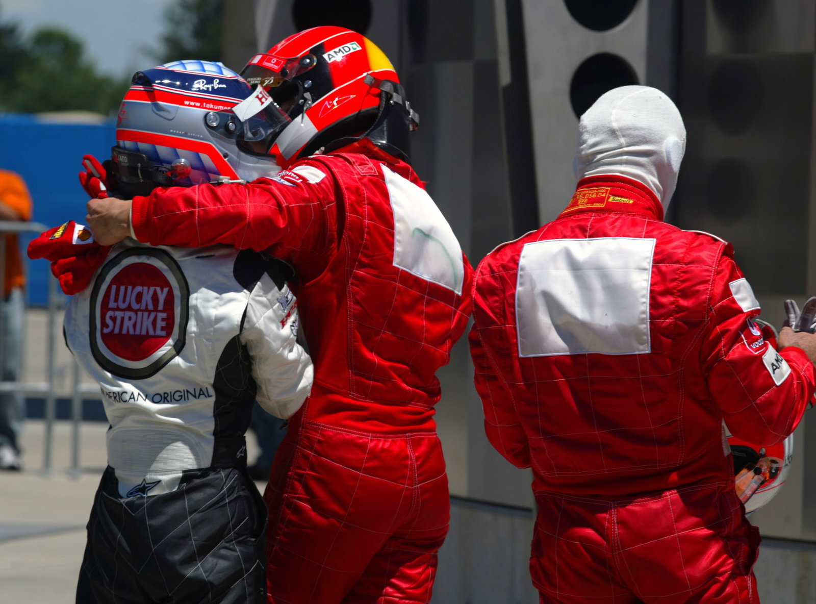 Michael Schumacher congratulates Takuma Sato