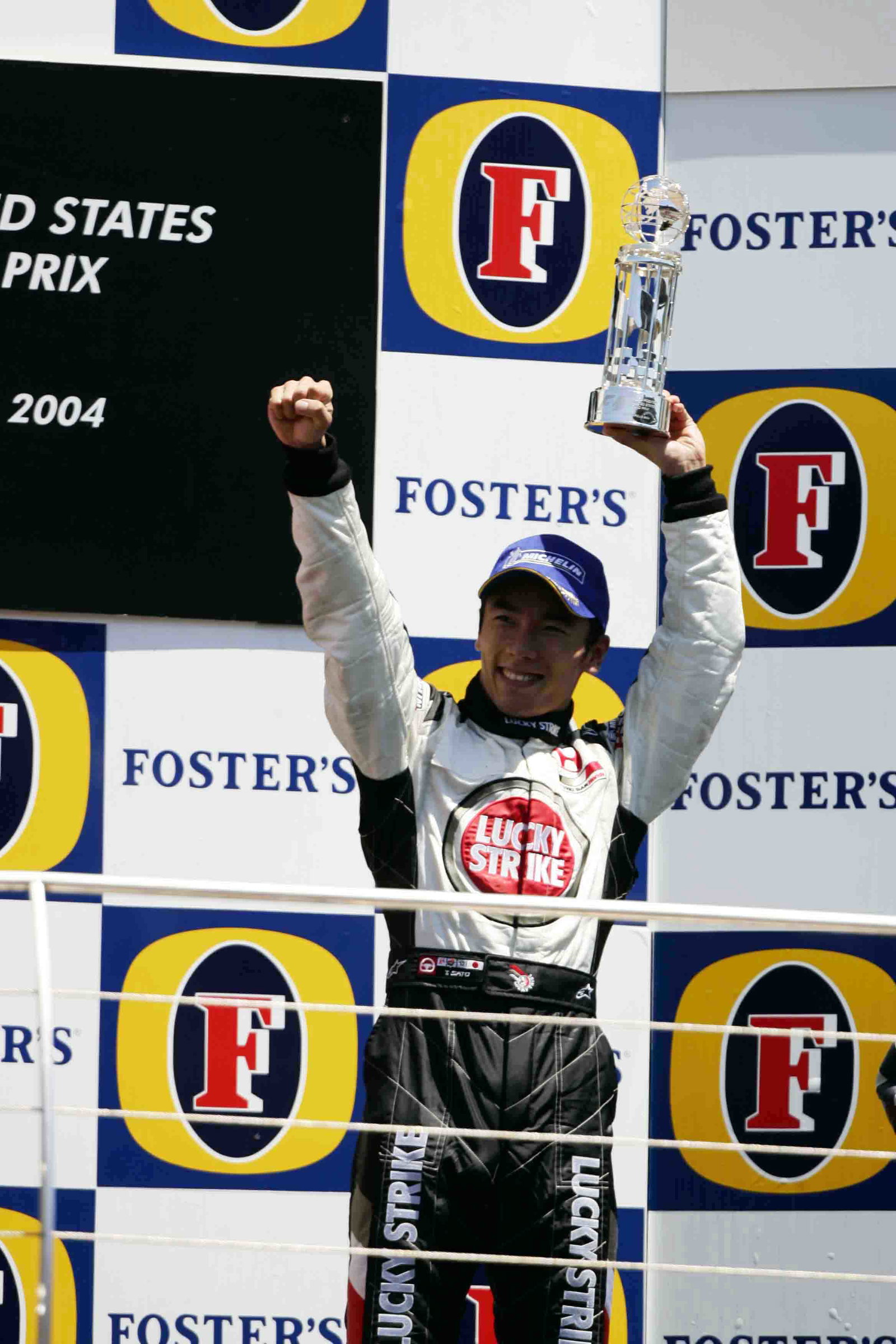 Takuma Sato celebrates his maiden podium finish in F1