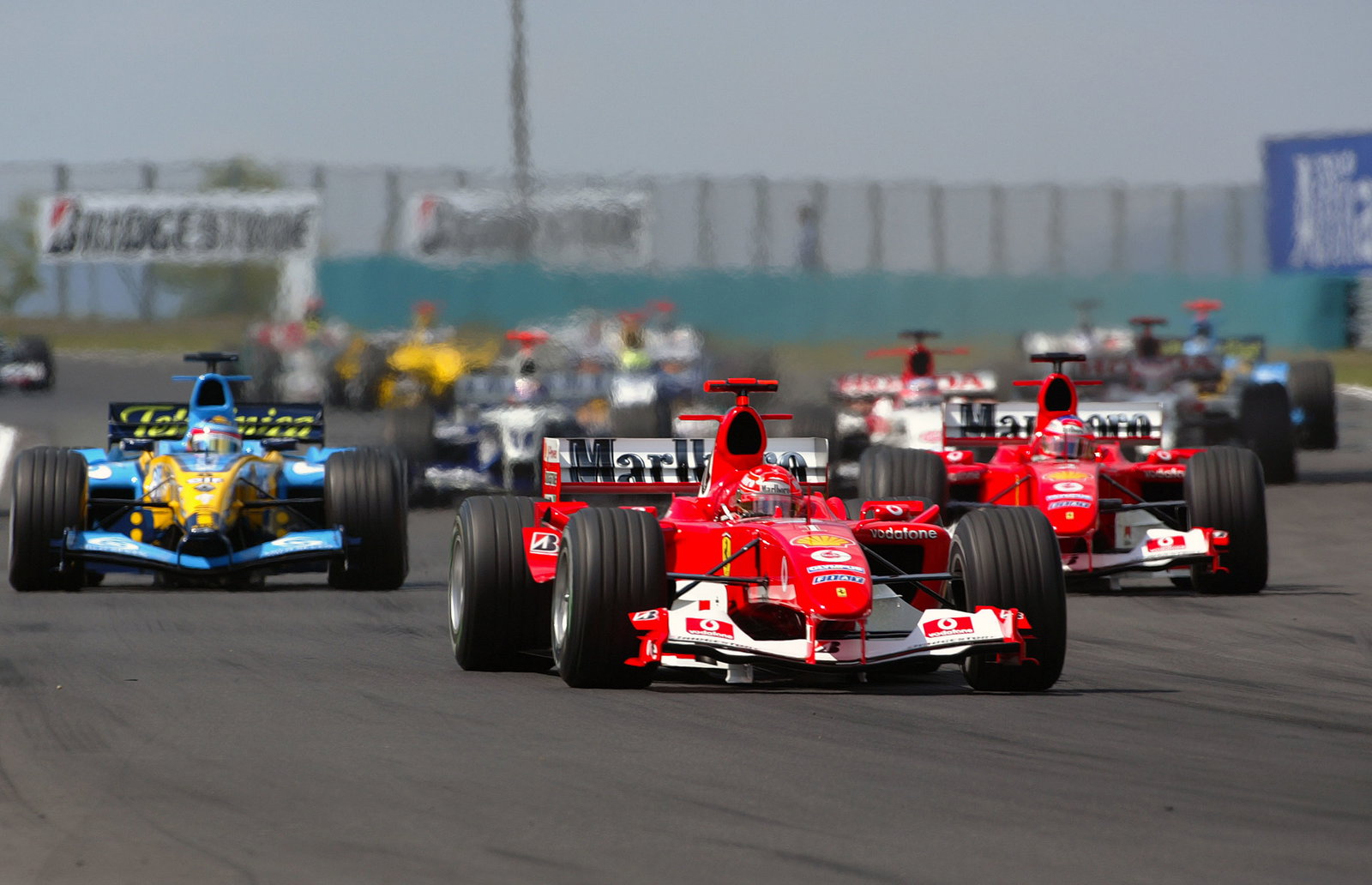 Michael Schumacher leads Ferrari team-mate Rubens Barrichello at the start of the Hungarian GP