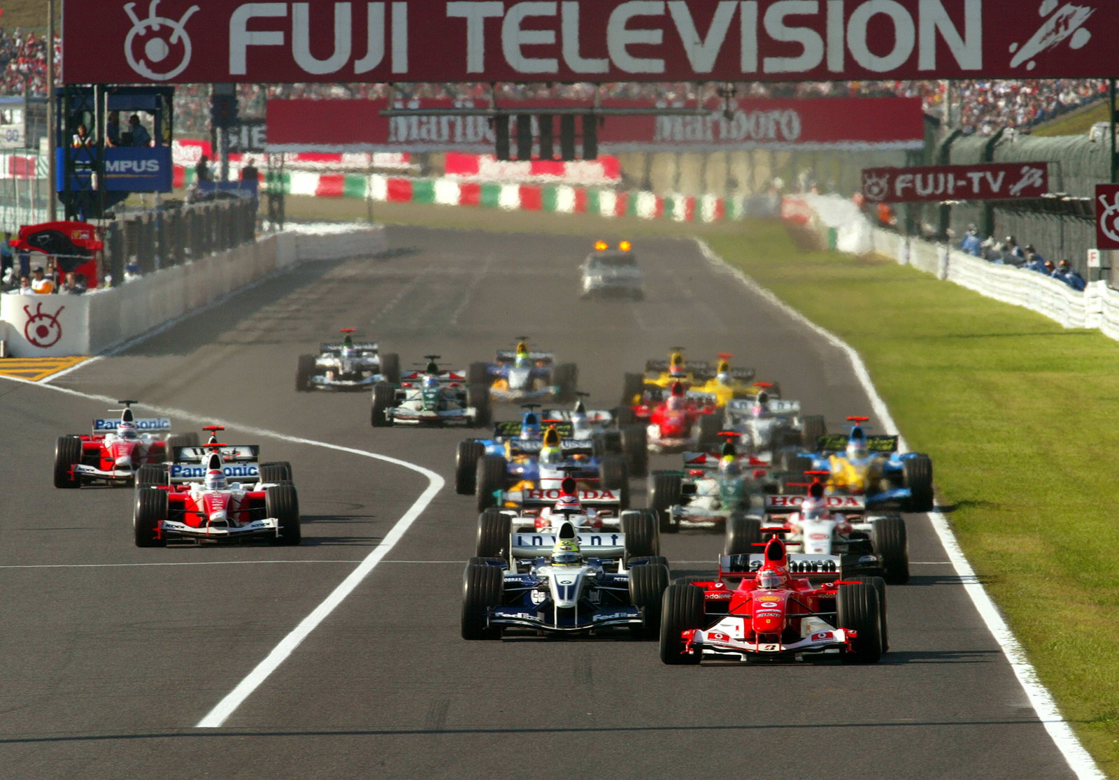 Michael Schumacher leads the field away at the start of the Japanese Grand Prix at Suzuka