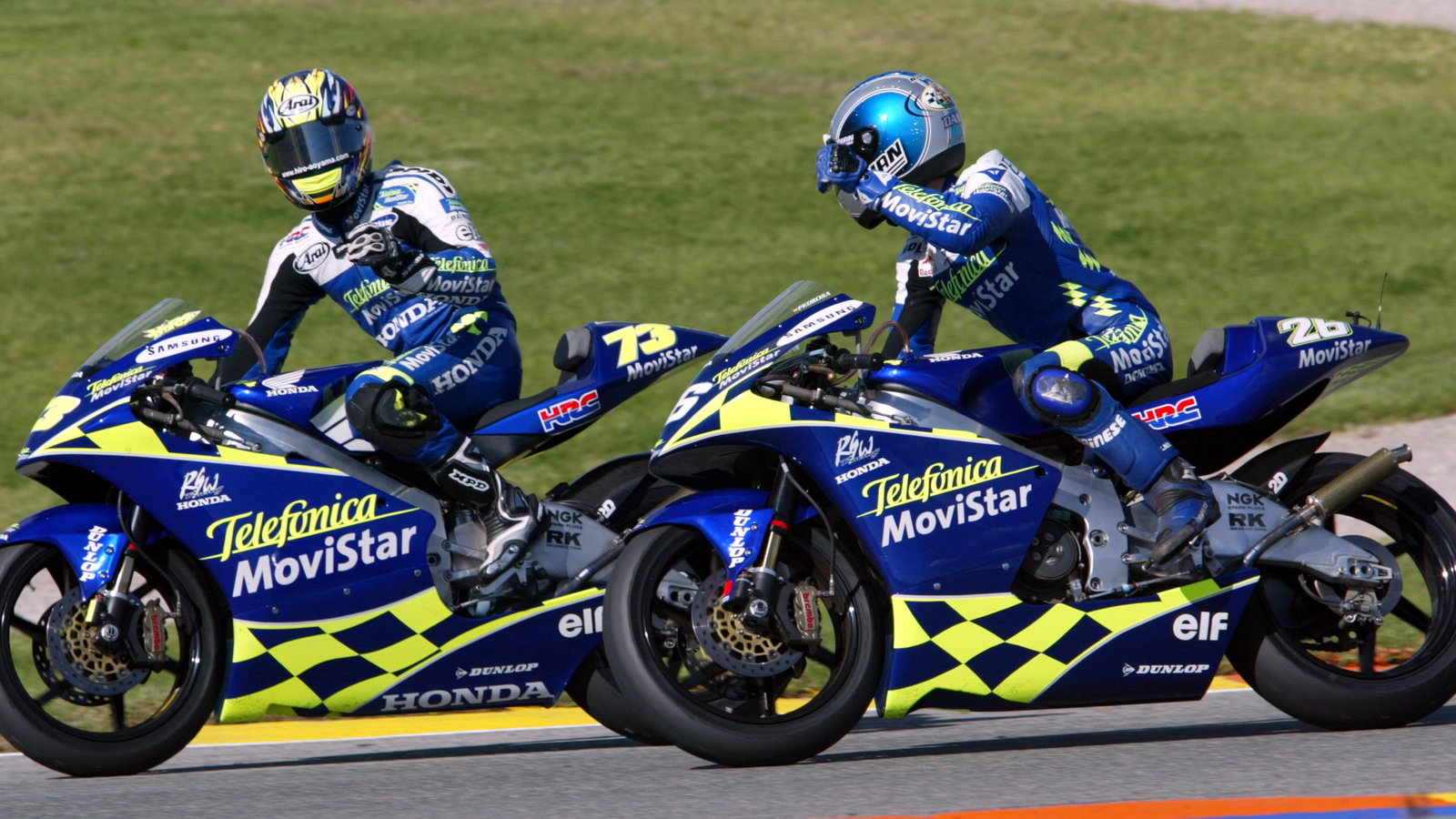 Telefonica Honda team-mates Aoyama and Pedrosa celebrate their 3-1 at Valencia, 250 GP 2004.