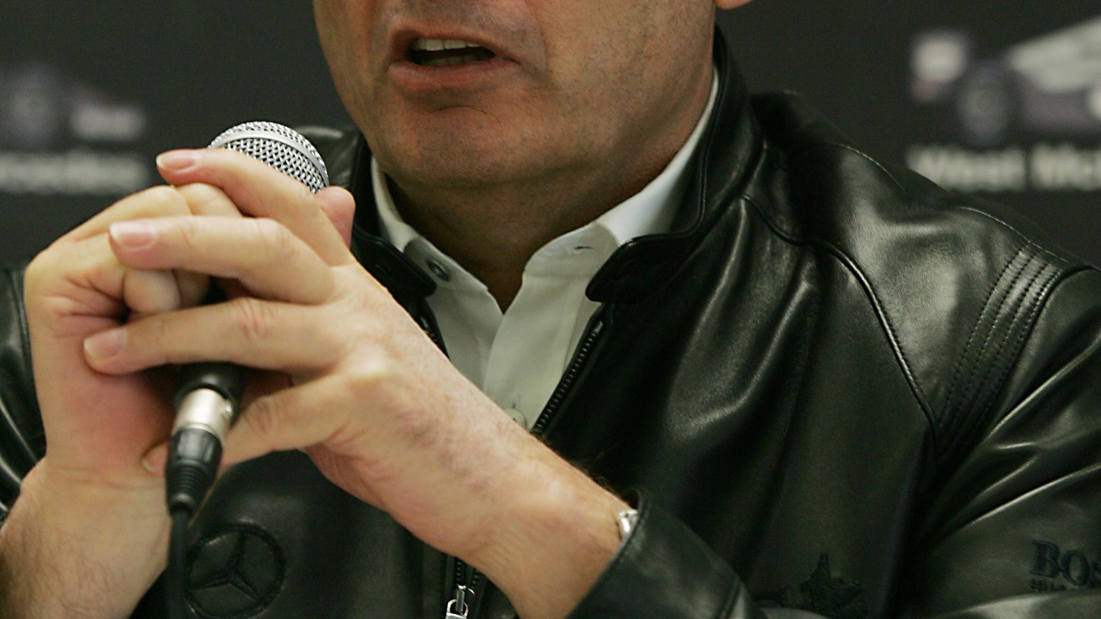 Ron Dennis addresses the media on the day that the new McLaren-Mercedes MP4-20 made its debut