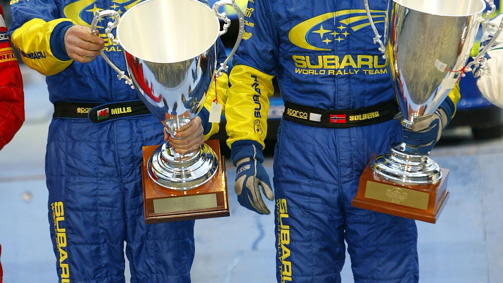 Subaru`s Petter Solberg and Phil Mills celebrate their victory on the Swedish Rally