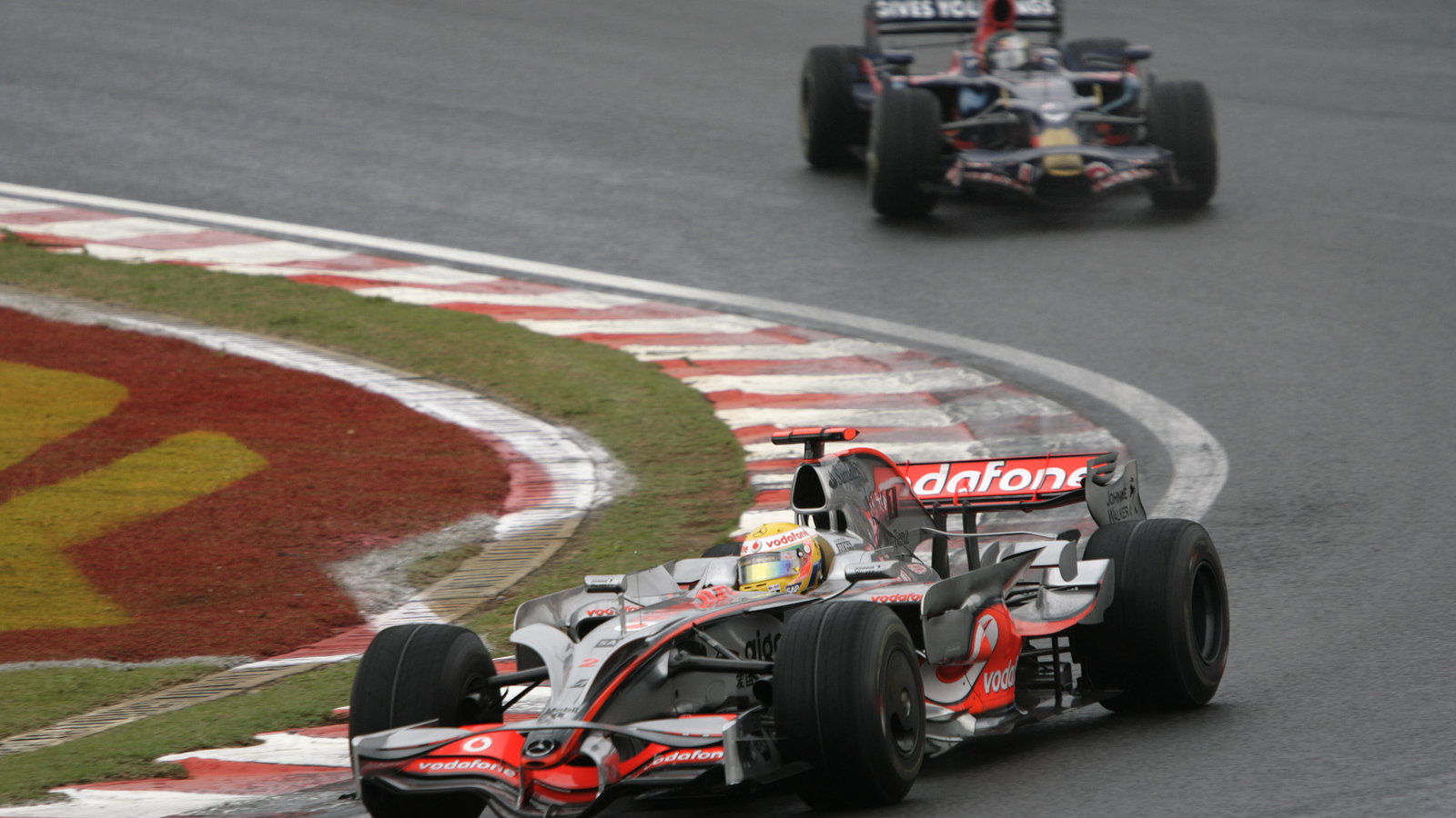 Lewis Hamilton (GBR) McLaren MP4-23, Sebastian Vettel (GER) Toro Rosso STR03, Brazilian F1 Grand Pri