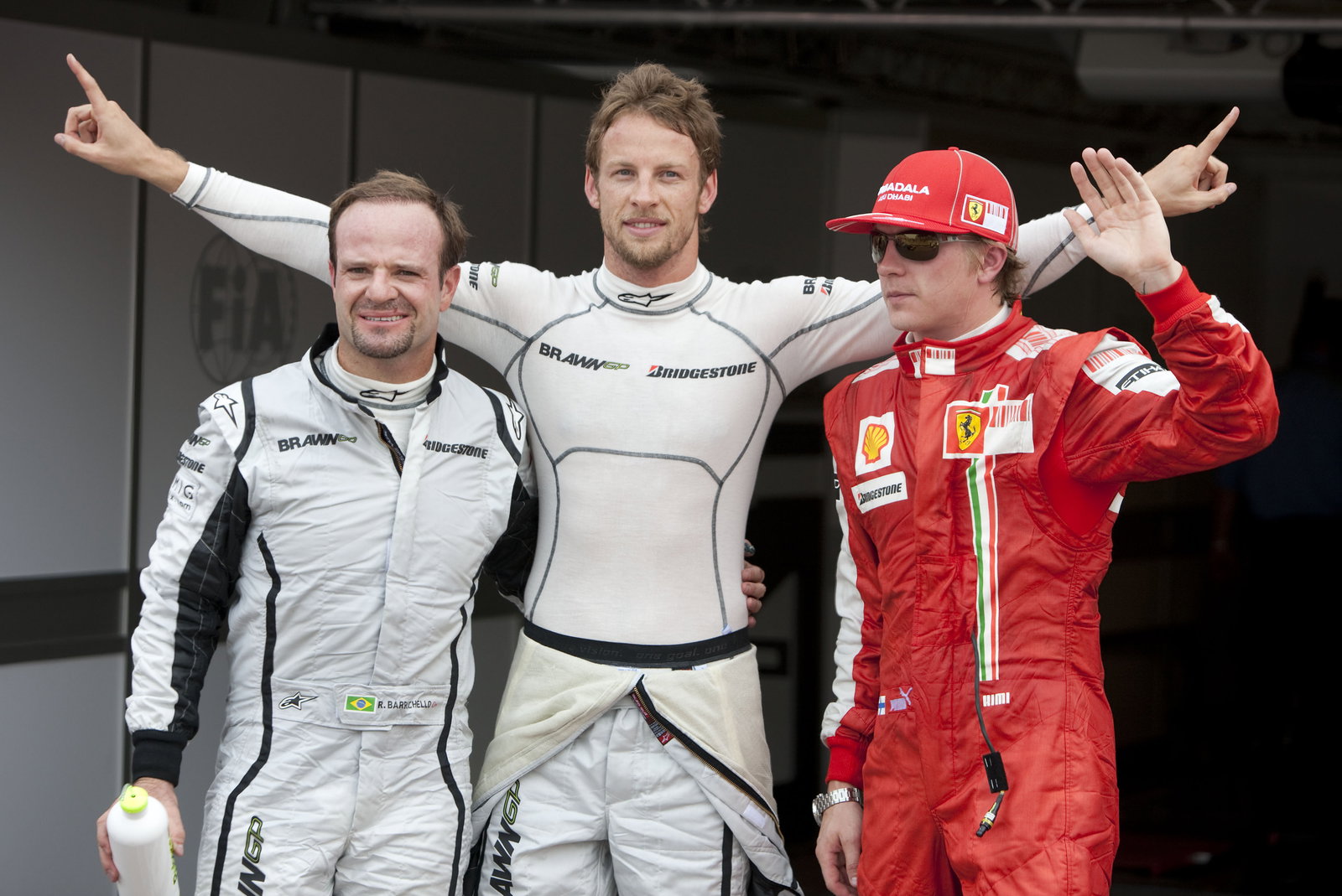 Rubens Barrichello (BRA) Brawn BGP001, Jenson Button (GBR) Brawn BGP001, Kimi Raikkonen (FIN) Ferrar