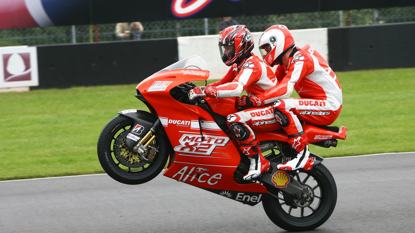 Mamola and Prince Harry on the 2-seater, British MotoGP 2009