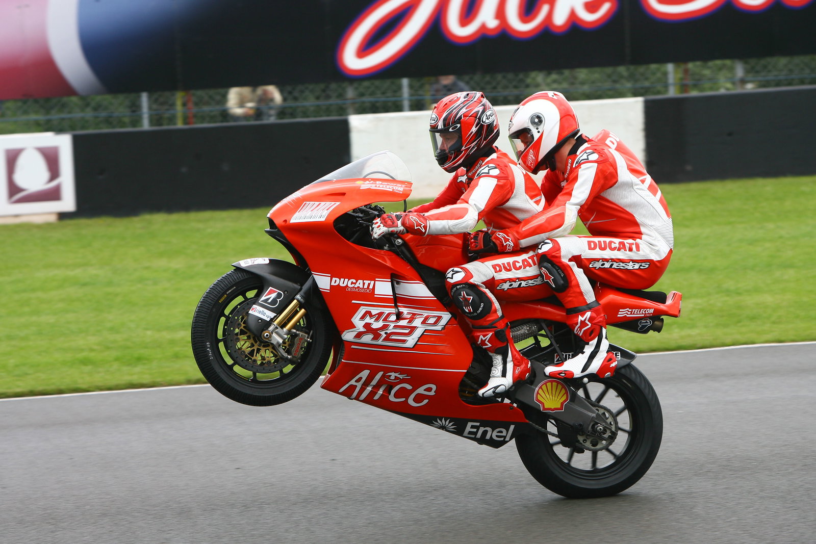 Mamola and Prince Harry on the 2-seater, British MotoGP 2009
