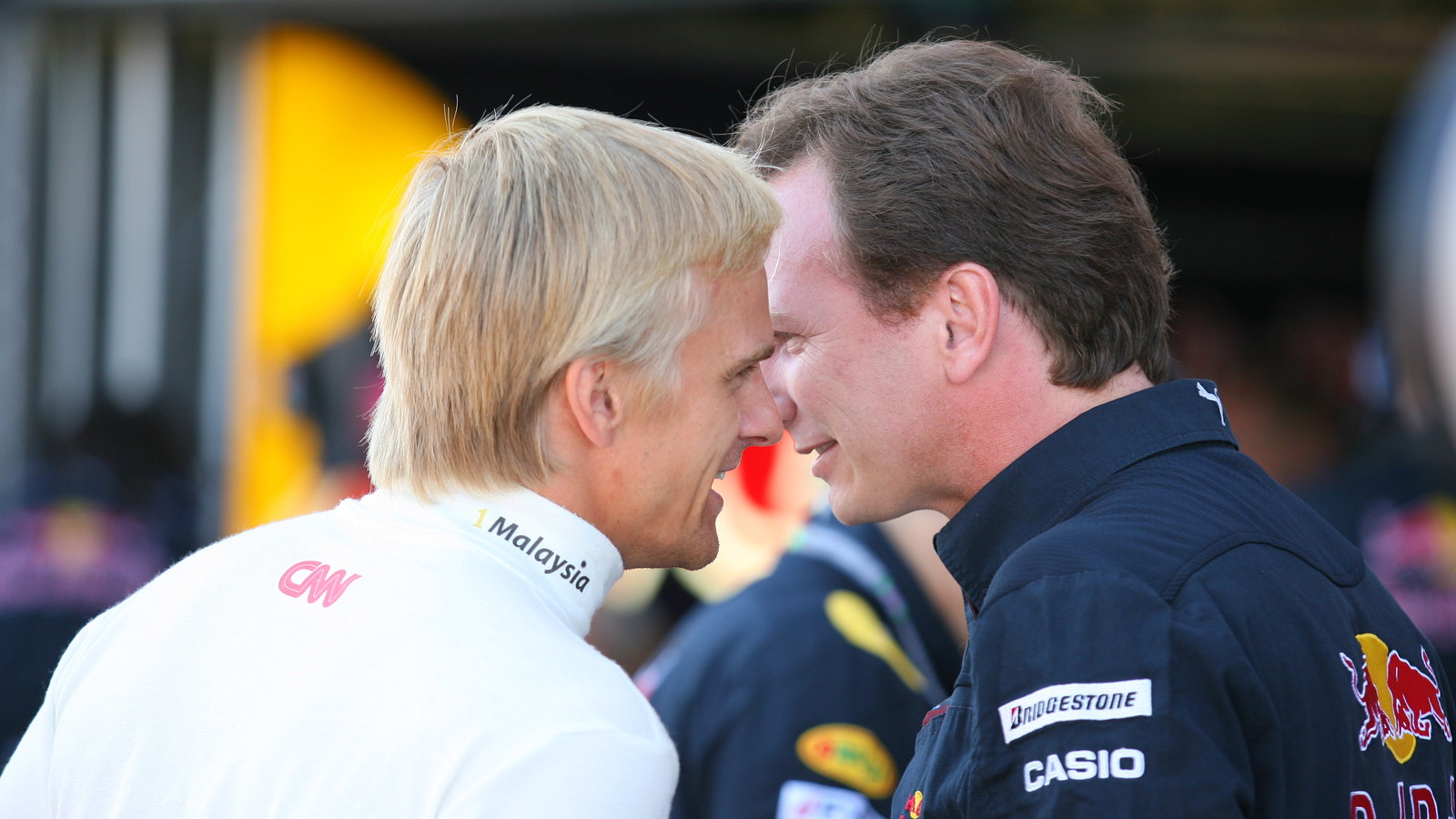 Friday Practice 1, Heikki Kovalainen (FIN), Lotus Racing, T127 and Christian Horner (GBR), Red Bull