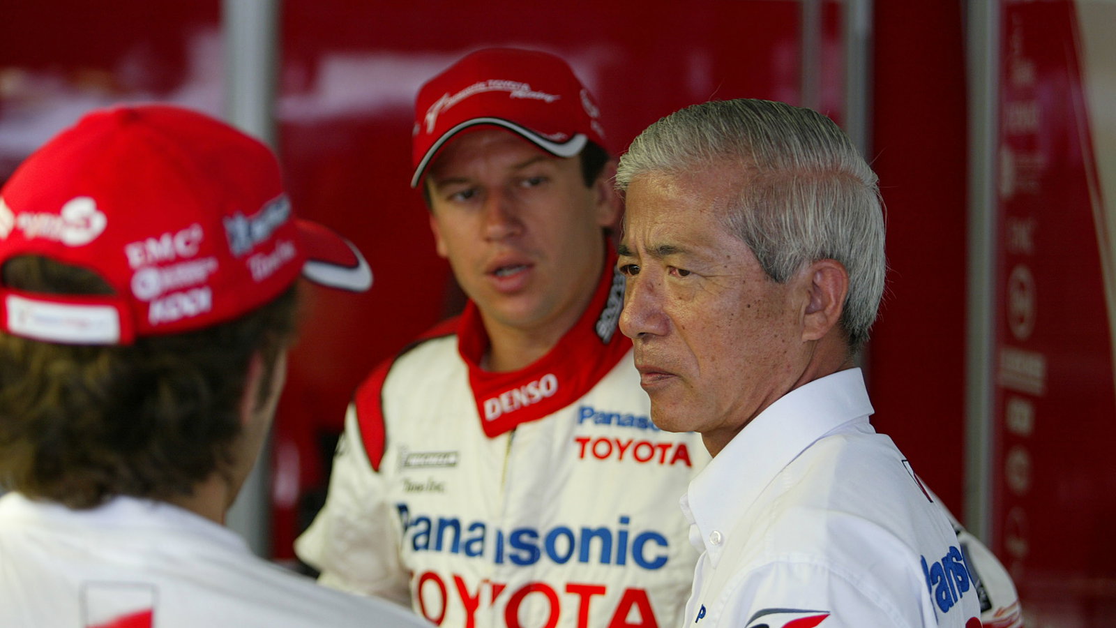 Cristiano da Matta and Olivier Panis talk with Toyota`s vice president