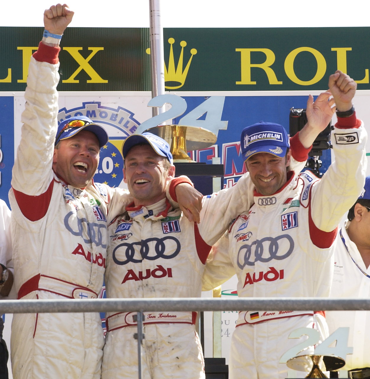 Tom Kristensen/Marco Werner/J.J. Lehto celebrate victory in the 2005 Le Mans 24 Hours.