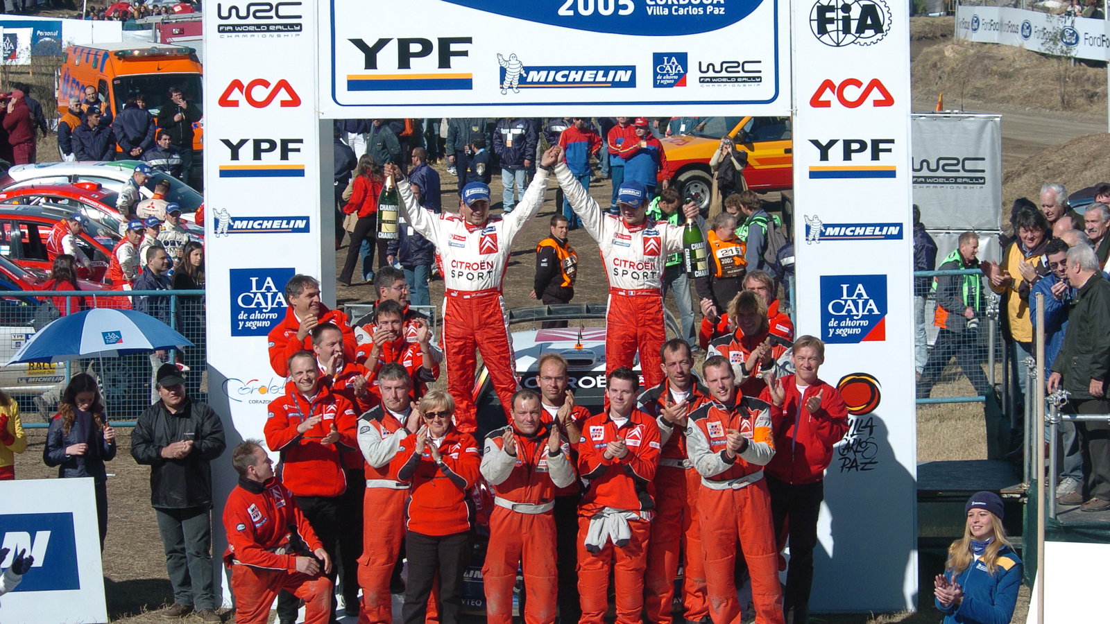 Sebastien Loeb and co-driver, Daniel Elena celebrate with the rest of the Citroen team after winning