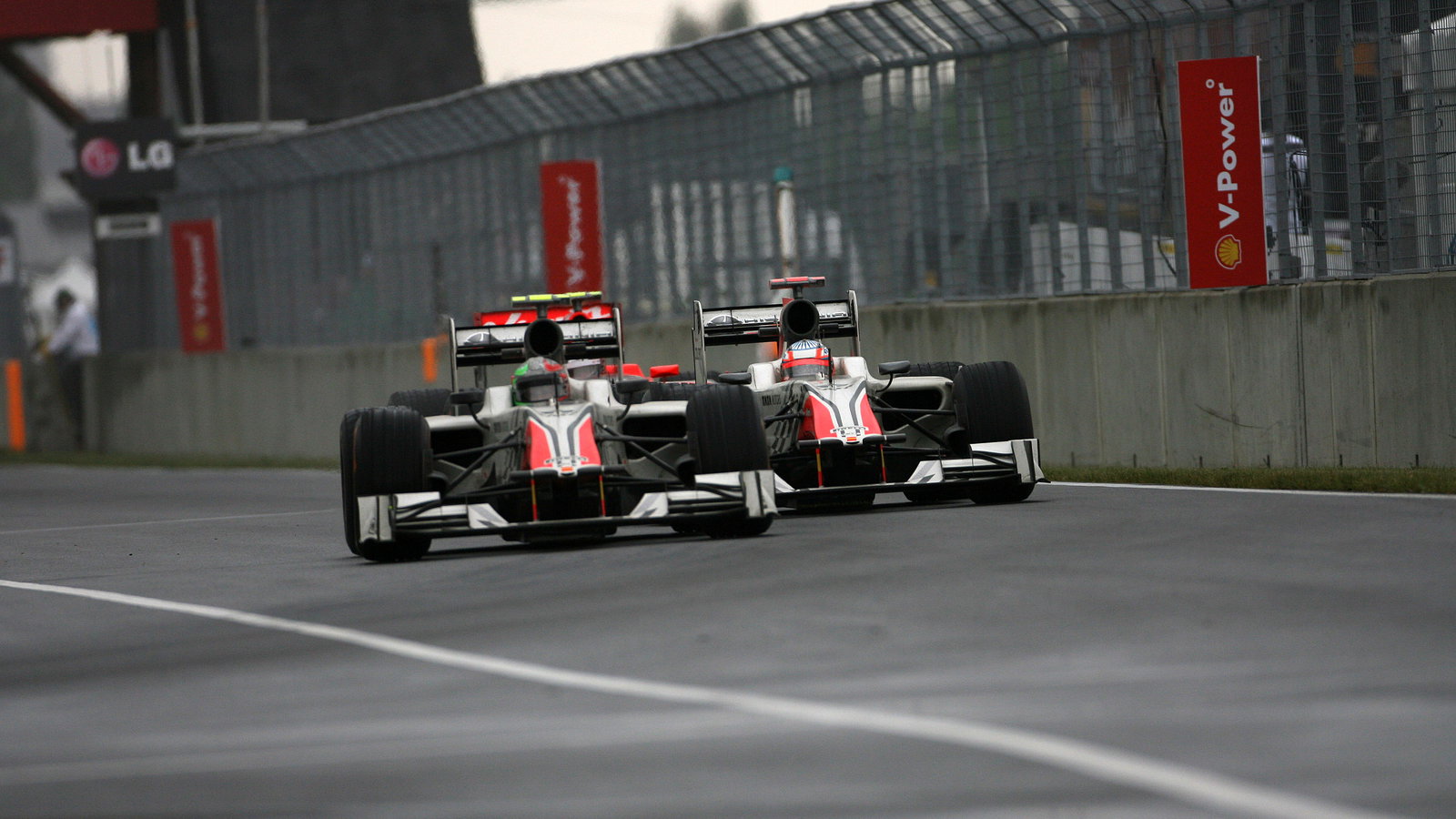 12.06.2011- Race, Vitantonio Liuzzi (ITA), Hispania Racing F1 Team, HRT and Narain Karthikeyan (IND