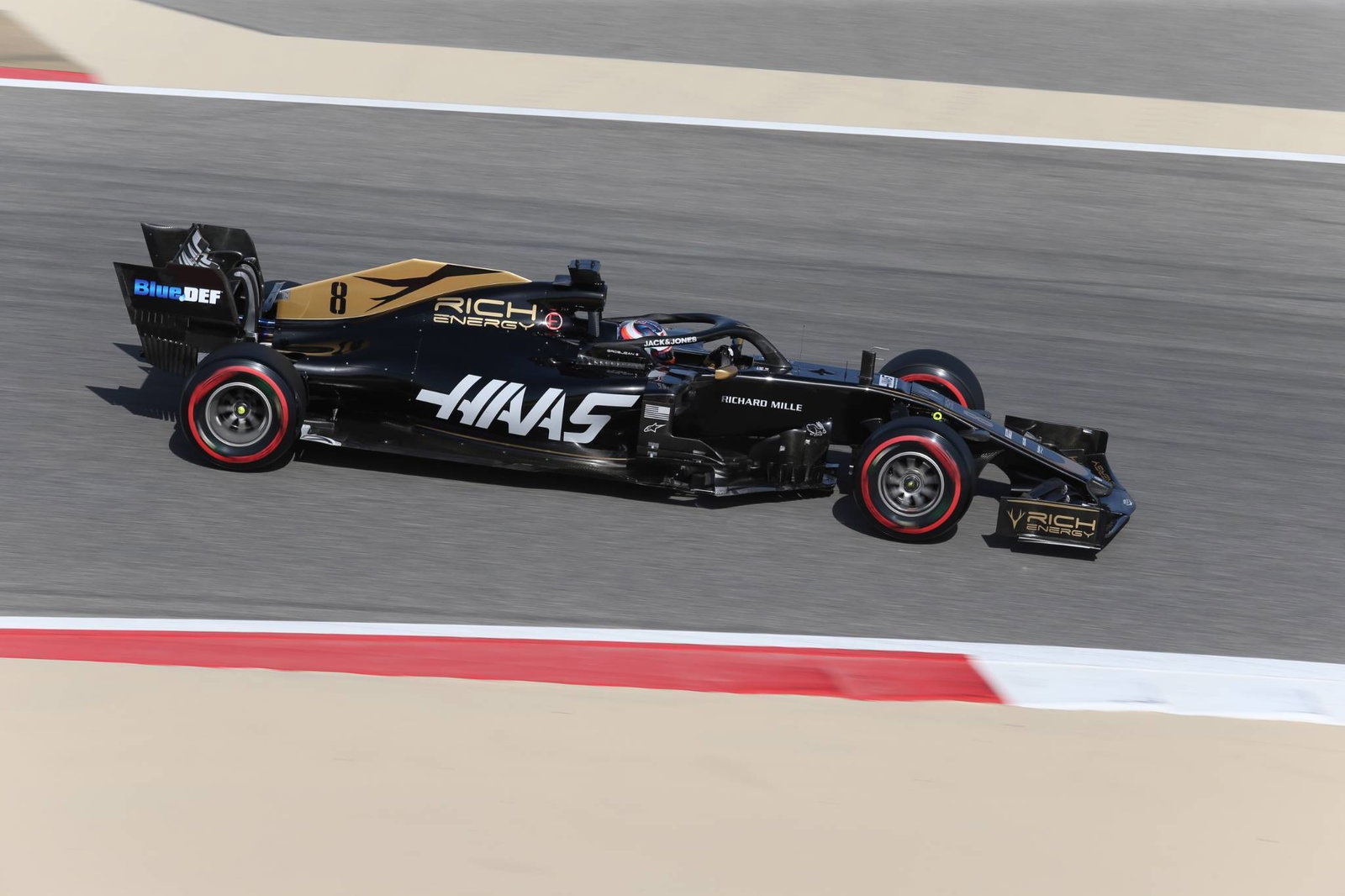 Grosjean leads rain-interrupted morning as Schumacher debuts
