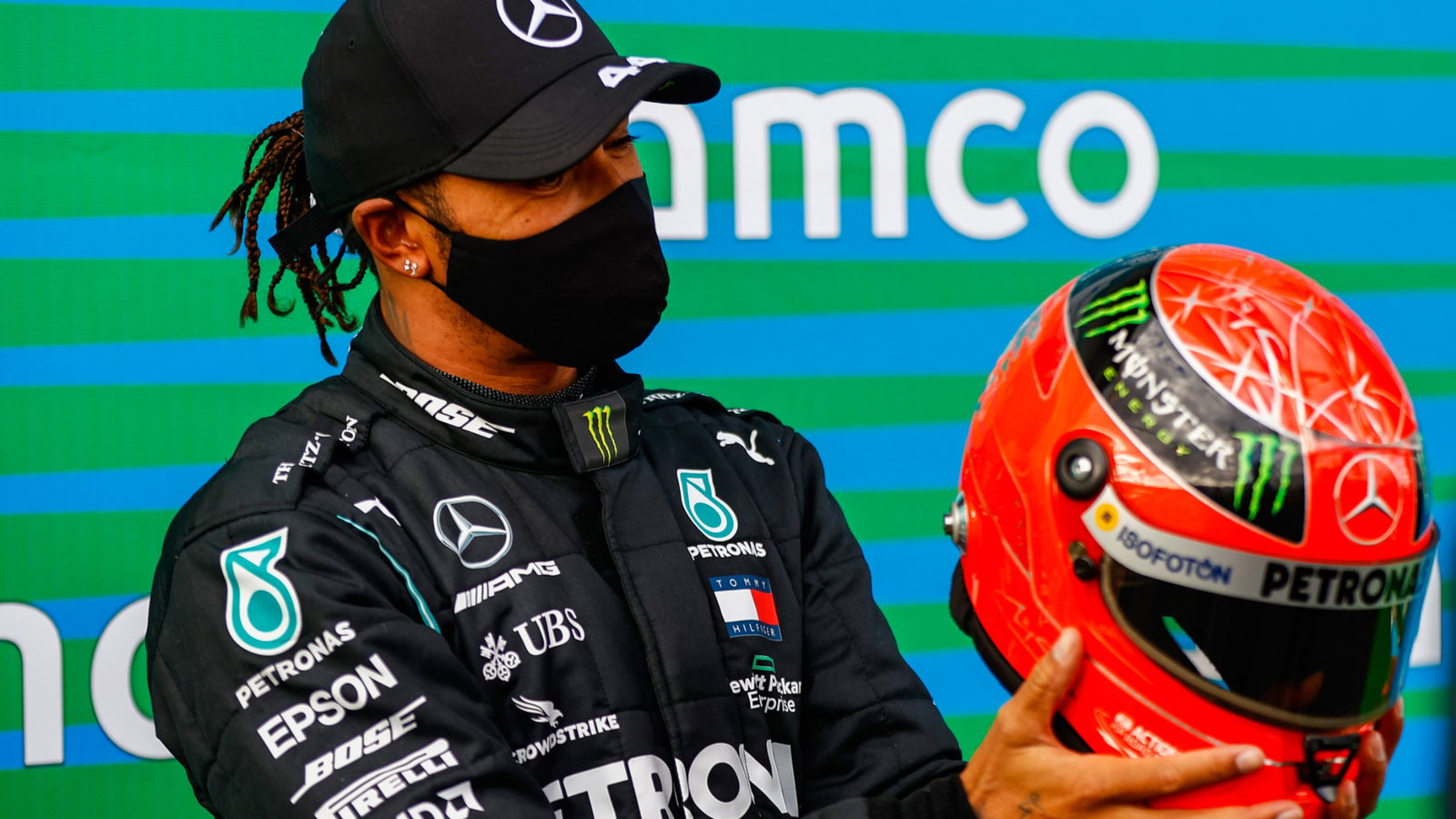 Race winner Lewis Hamilton (GBR) Mercedes AMG F1 is presented with the helmet of Michael Schumacher (GER) in parc ferme after equalling the record for the number of F1 victories.