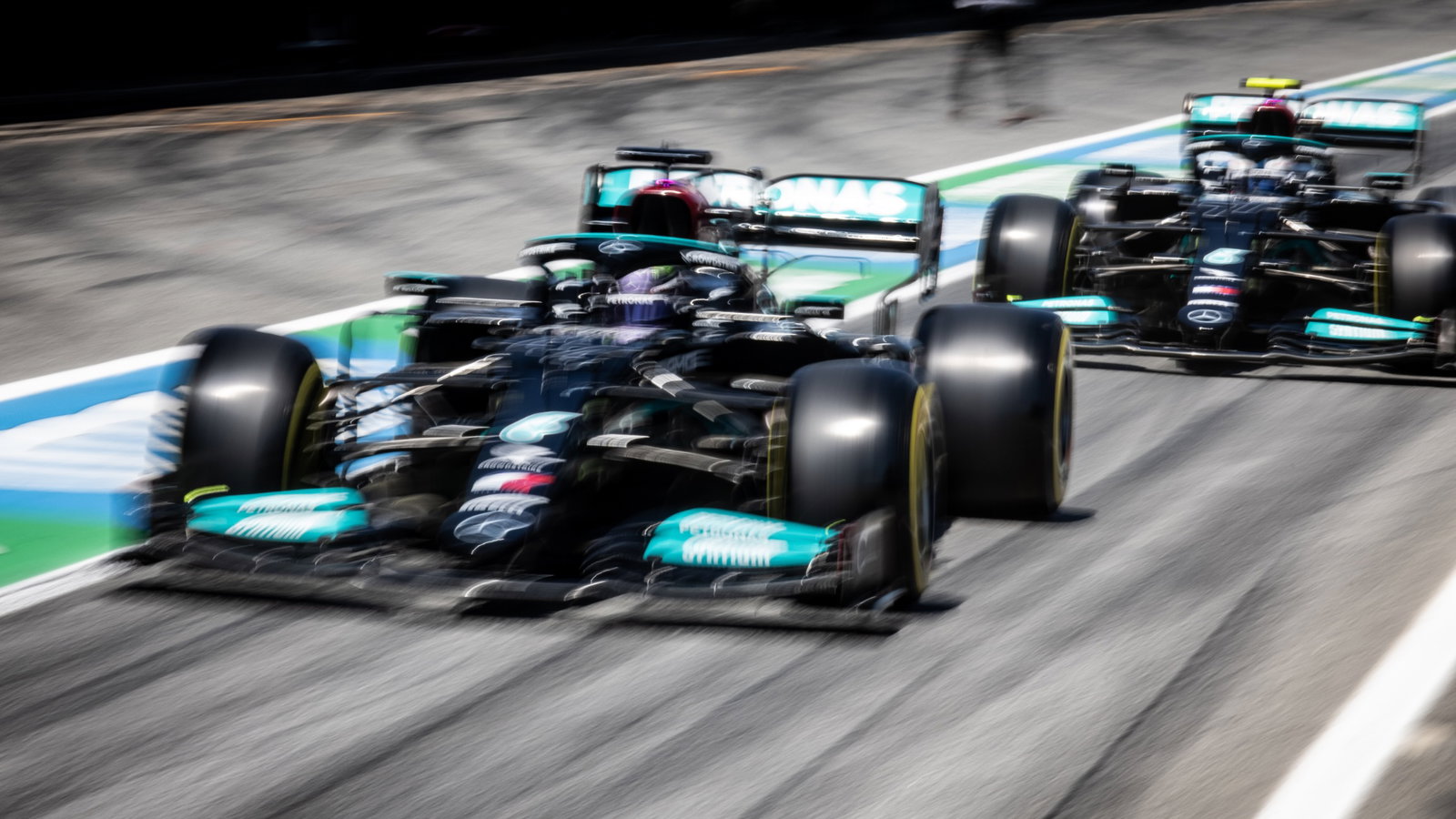 Lewis Hamilton (GBR) Mercedes AMG F1 W12 and Valtteri Bottas (FIN) Mercedes AMG F1 W12.