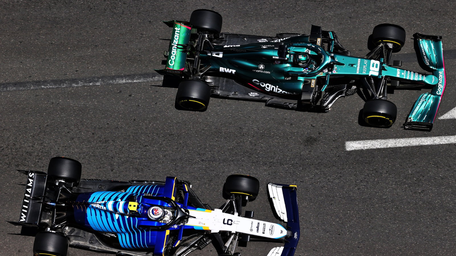Lance Stroll (CDN) Aston Martin F1 Team AMR21 and Nicholas Latifi (CDN) Williams Racing FW43B.