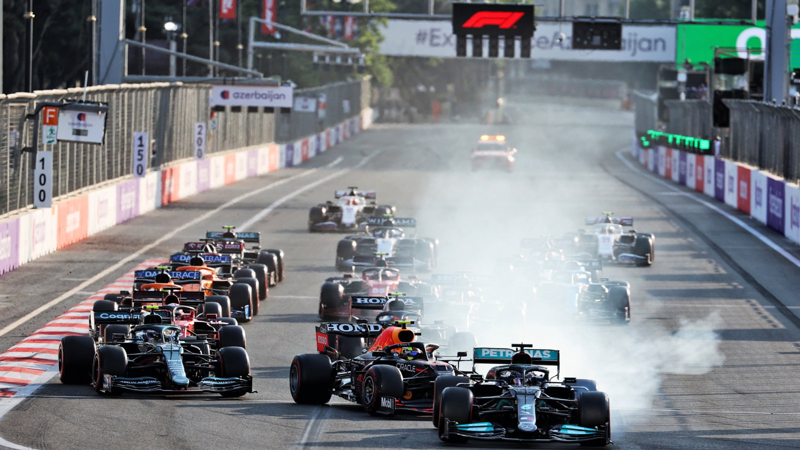 Lewis Hamilton (GBR) Mercedes AMG F1 W12 locks up under braking at the restart of the race while attempting to pass Sergio Perez (MEX) Red Bull Racing RB16B.