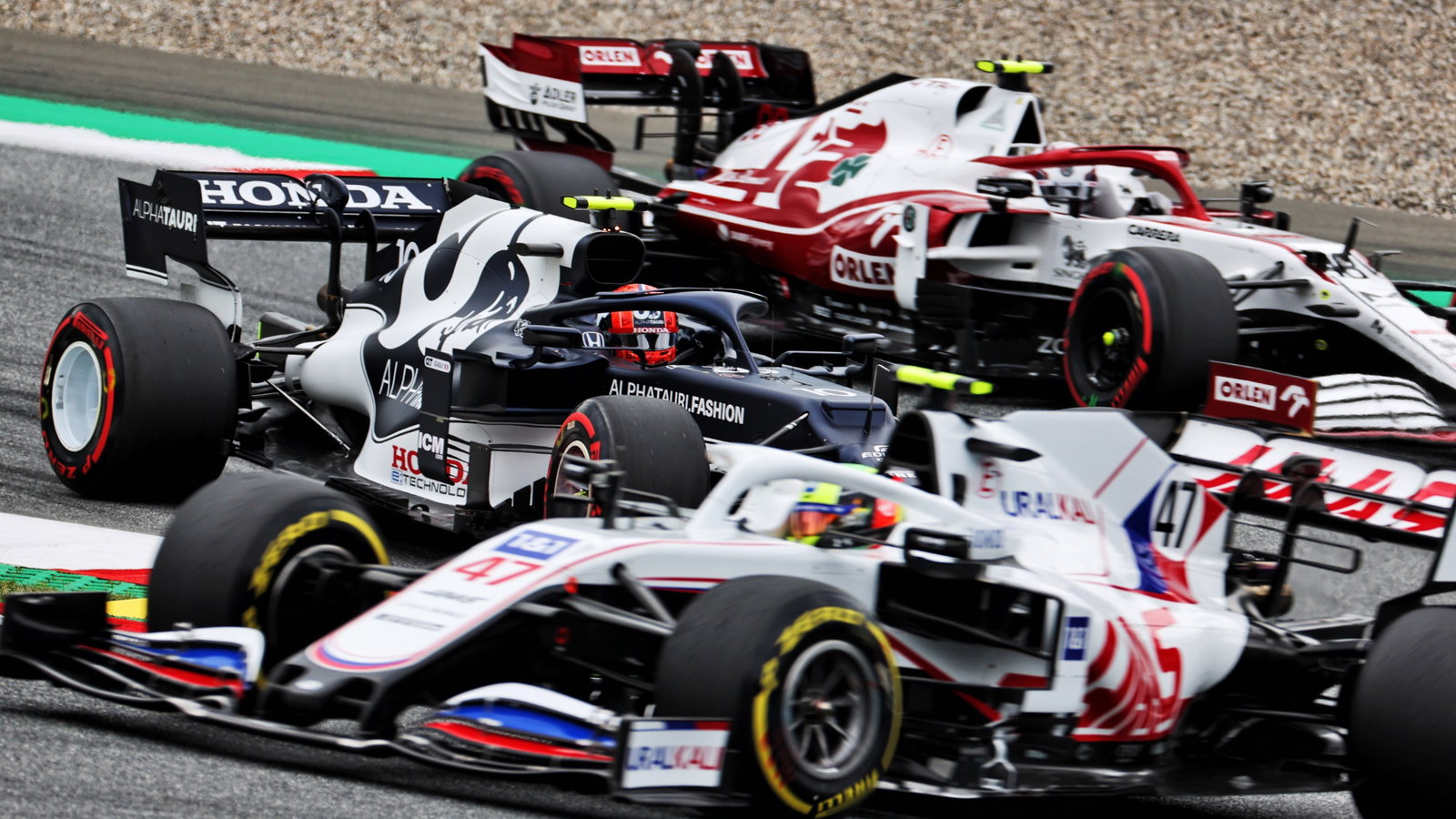 Pierre Gasly (FRA) AlphaTauri AT02 sandwiched inbetween Mick Schumacher (GER) Haas VF-21 and Callum Ilott (GBR) Alfa Romeo Racing C41 Reserve Driver.