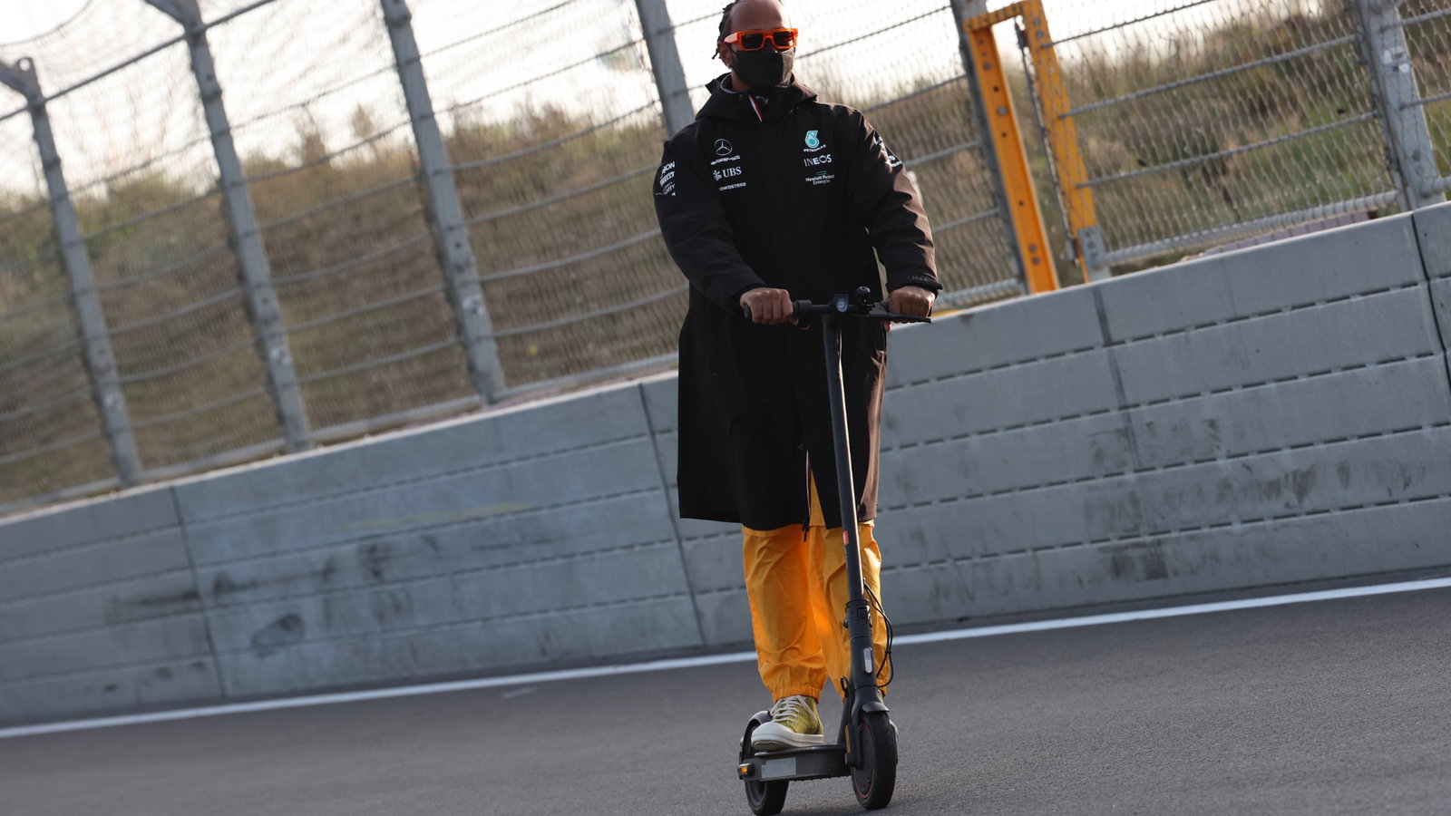 Lewis Hamilton (GBR) Mercedes AMG F1 W12 checks out the circuit on a scooter.
