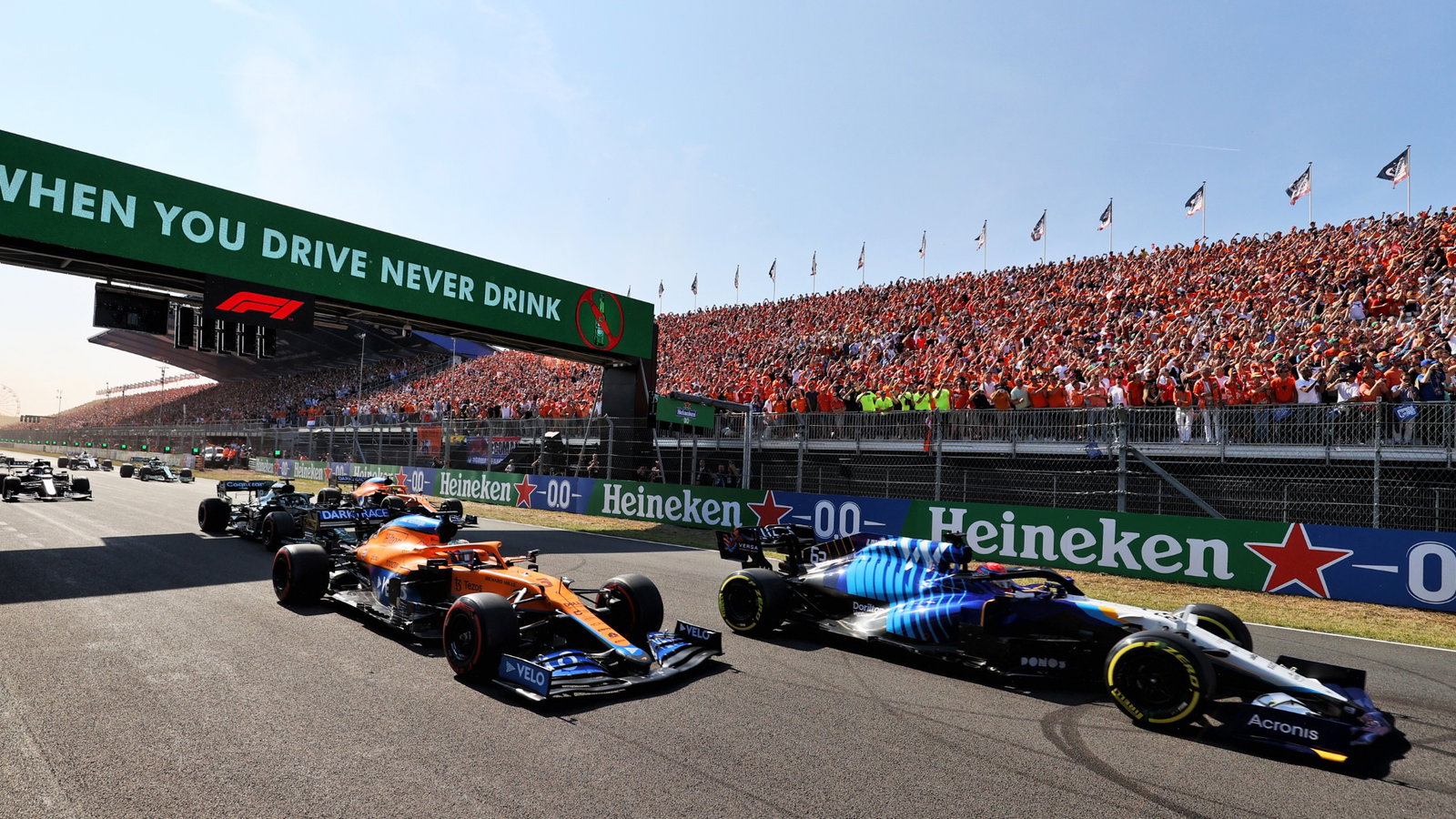 George Russell (GBR) Williams Racing FW43B leads Daniel Ricciardo (AUS) McLaren MCL35M at the start of the race.