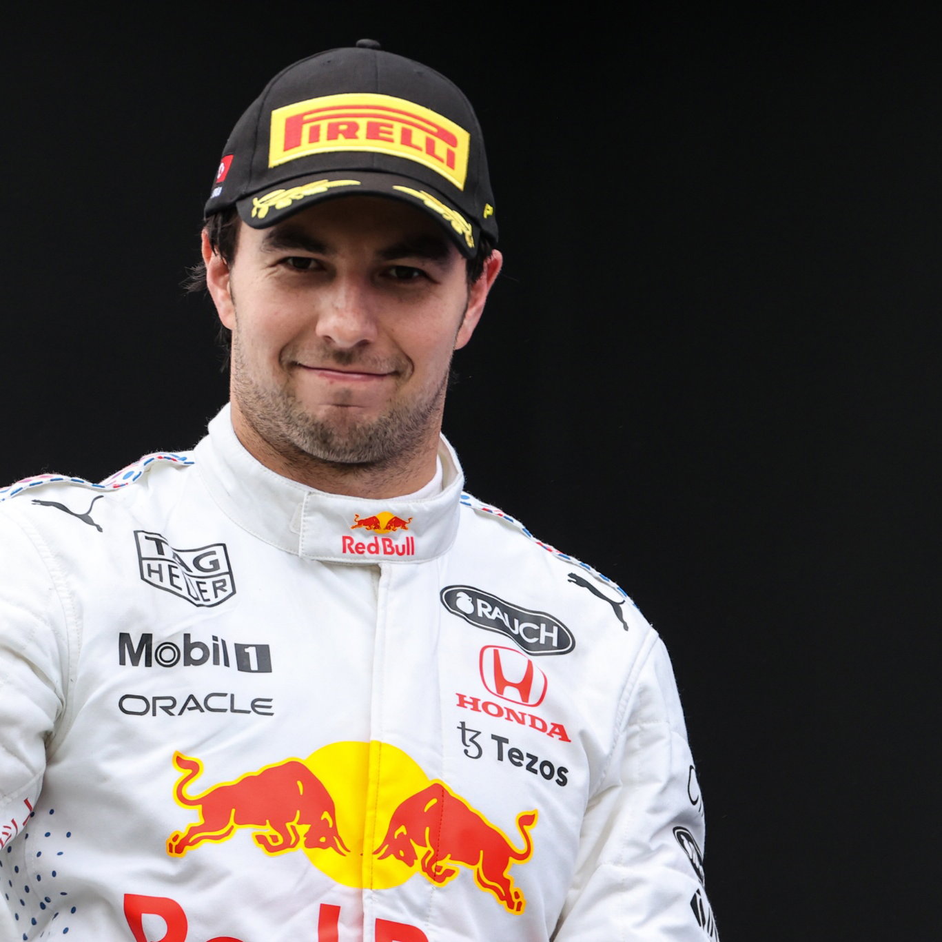 Sergio Perez (MEX) Red Bull Racing celebrates his third position on the podium.