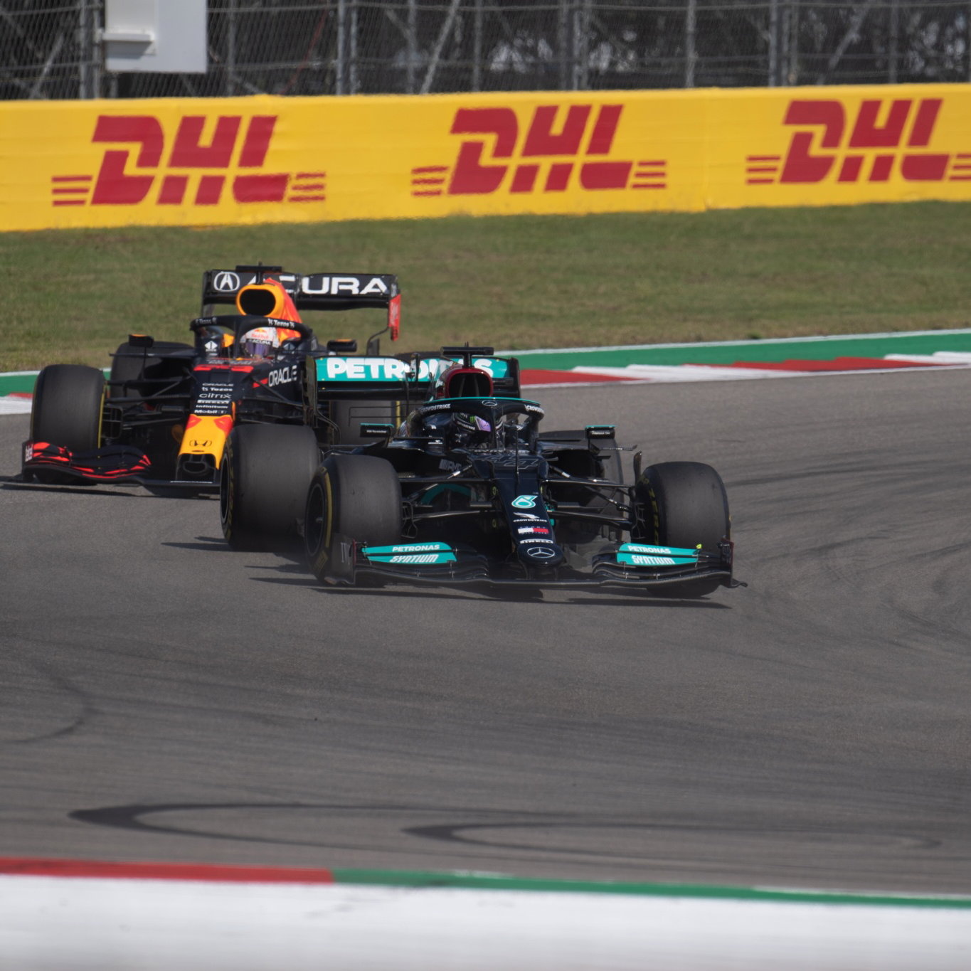 Lewis Hamilton (GBR) Mercedes AMG F1 W12 leads Max Verstappen (NLD) Red Bull Racing RB16B.