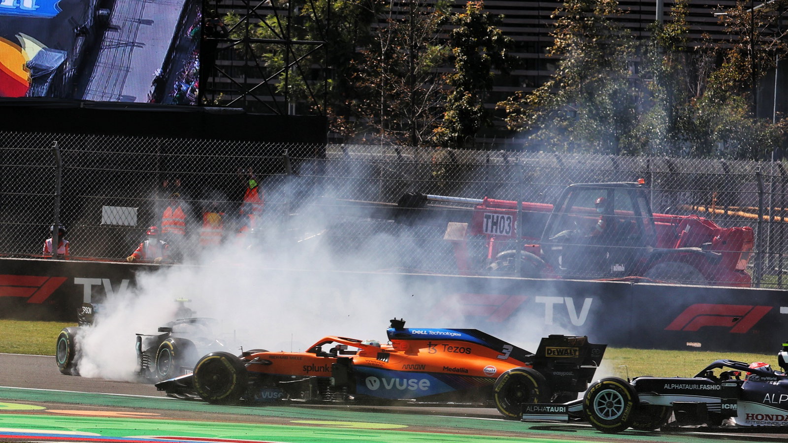 Valtteri Bottas (FIN) Mercedes AMG F1 W12 spins after being hit by Daniel Ricciardo (AUS) McLaren MCL35M at the start of the race.