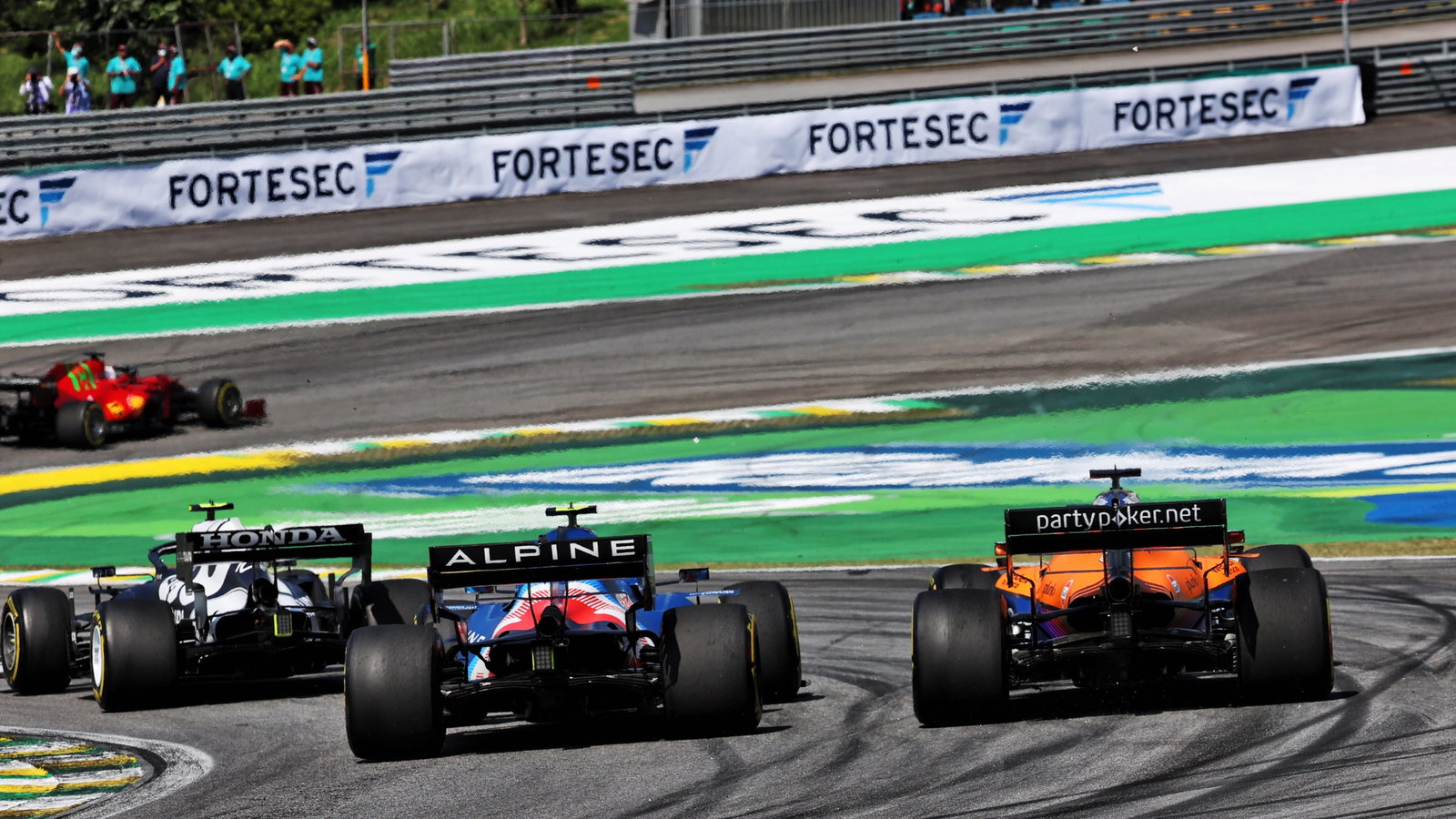 Esteban Ocon (FRA) Alpine F1 Team A521 and Daniel Ricciardo (AUS) McLaren MCL35M battle for position.