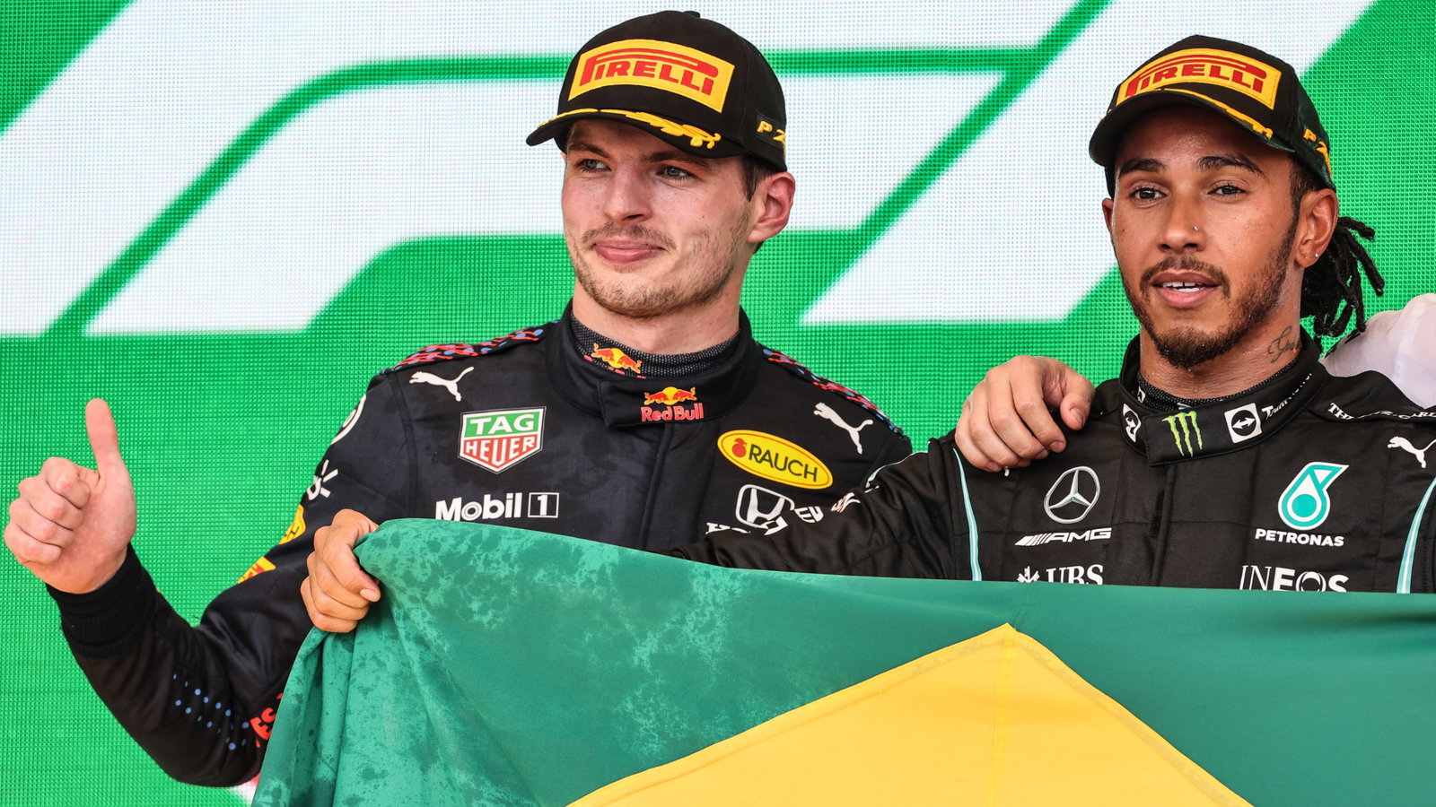 (L to R): Second placed Max Verstappen (NLD) Red Bull Racing celebrates on the podium with race winner Lewis Hamilton (GBR) Mercedes AMG F1.