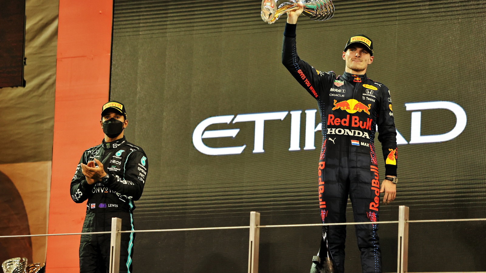 Race winner and World Champion Max Verstappen (NLD) Red Bull Racing celebrates on the podium alongside second placed Lewis Hamilton (GBR) Mercedes AMG F1 (Left).