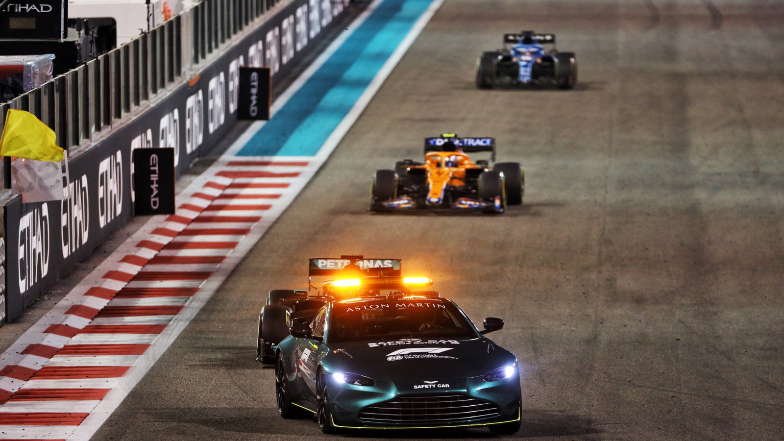 Lewis Hamilton (GBR) Mercedes AMG F1 W12 leads behind the Aston Martin FIA Safety Car.