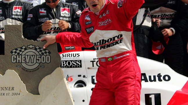Castroneves climbs fence at Richmond.
