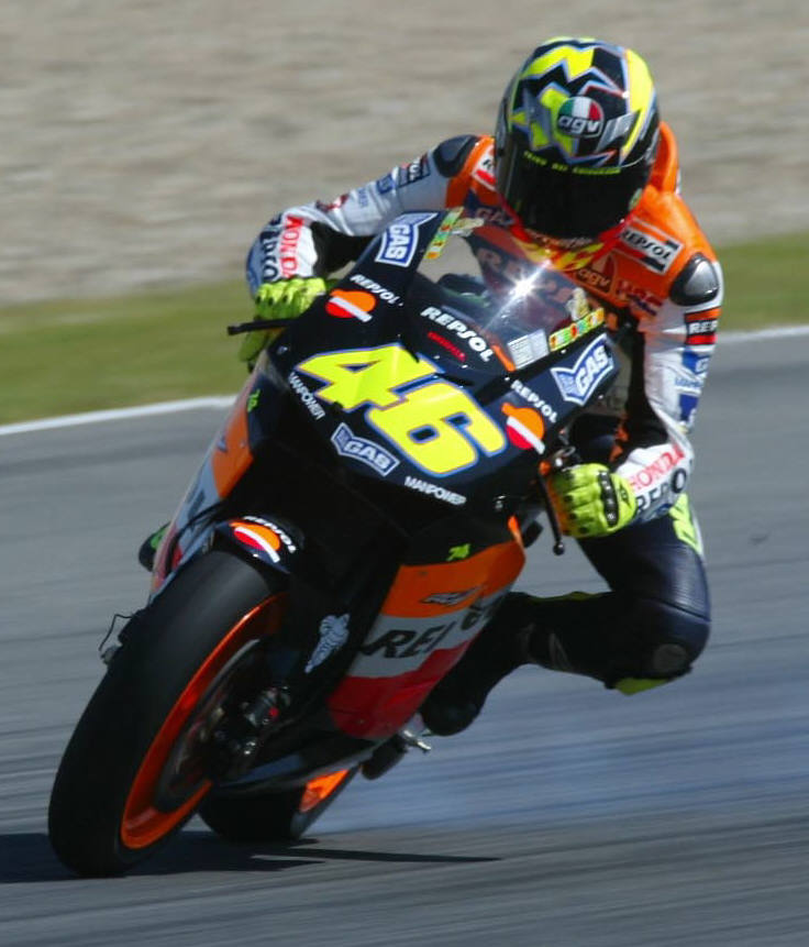 Cecchinello wins bar-banging 125 race.