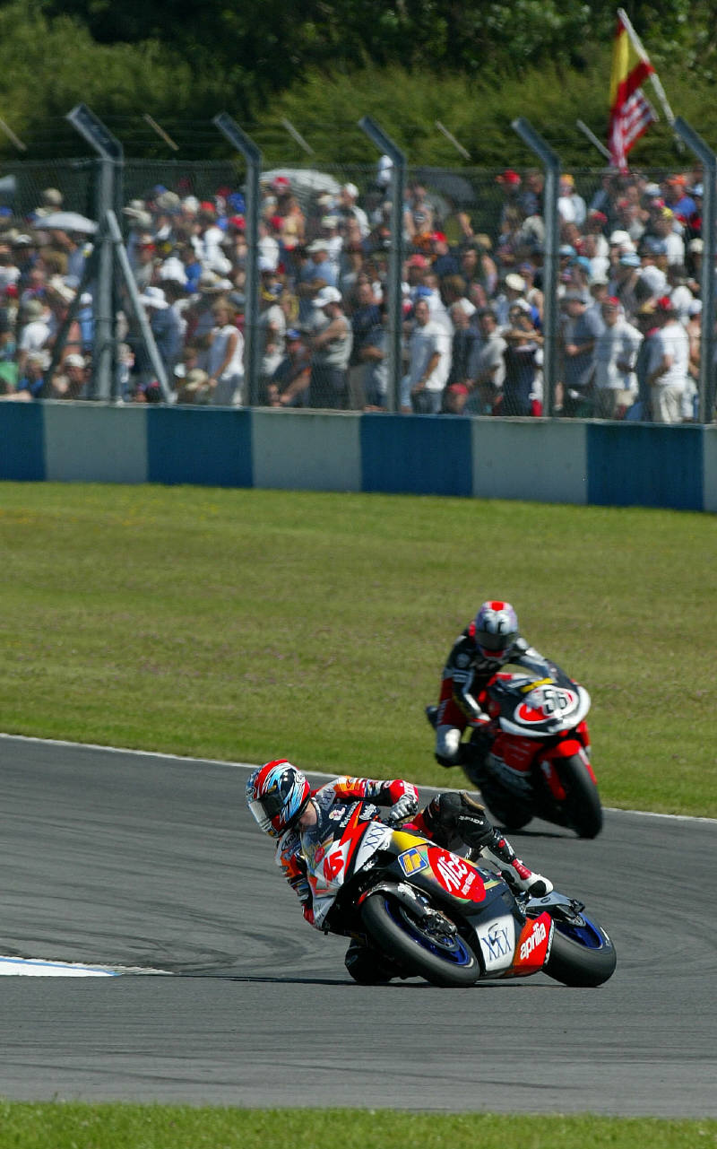 Biaggi takes win after Rossi penalised.