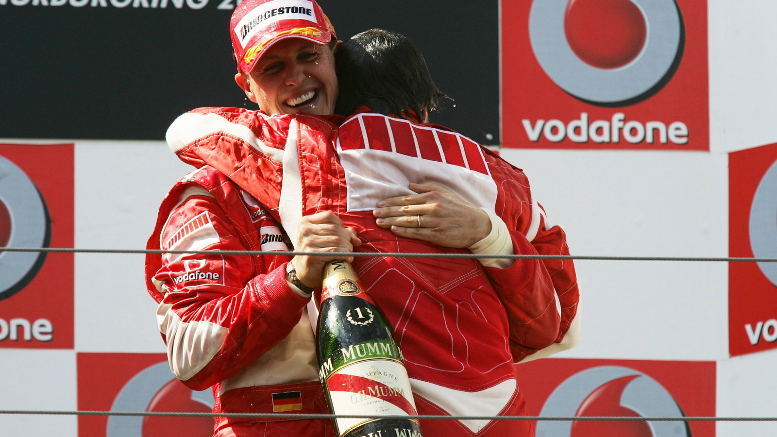  Nürburg, Germany,Michael Schumacher (GER), Scuderia Ferrari hugs Felipe Massa (BRA), Scuderia Ferrari - Formula 1 World