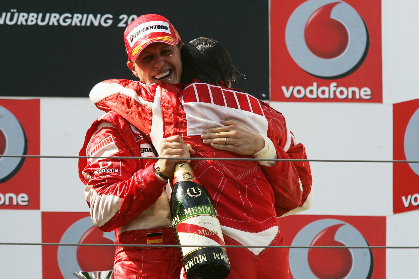  Nürburg, Germany,Michael Schumacher (GER), Scuderia Ferrari hugs Felipe Massa (BRA), Scuderia Ferrari - Formula 1 World