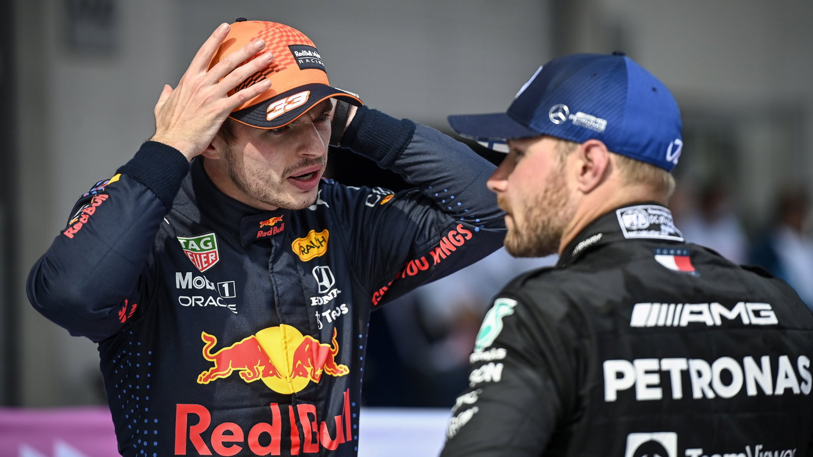 (L to R): Race winner Max Verstappen (NLD) Red Bull Racing with second placed Valtteri Bottas (FIN) Mercedes AMG F1 in parc