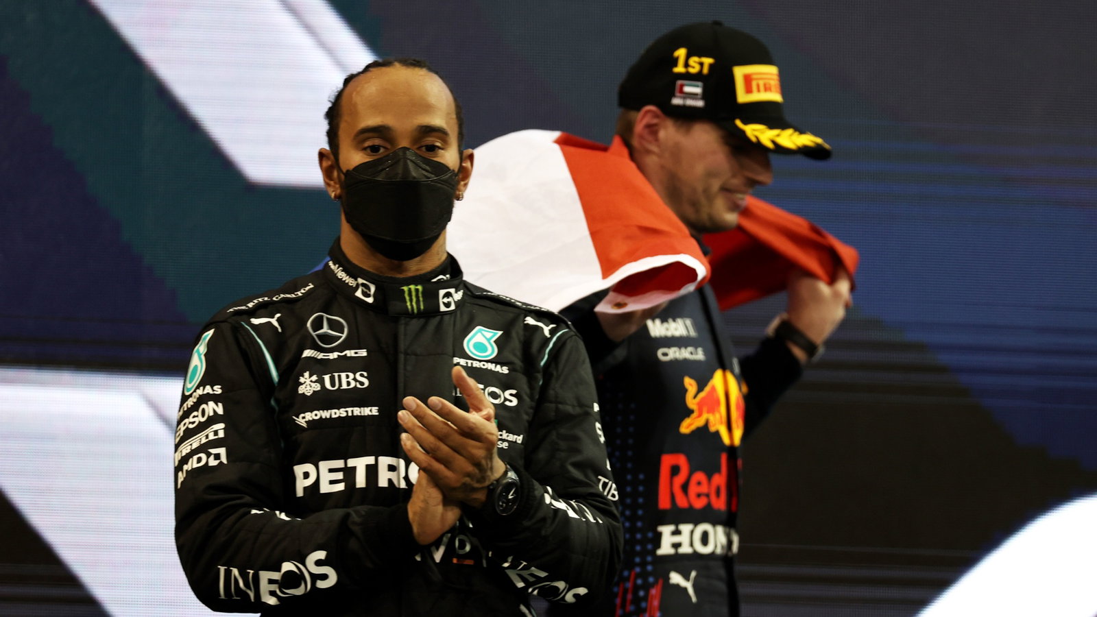 Lewis Hamilton (GBR) Mercedes AMG F1 W12 with 1st place and new World Champion, Max Verstappen (NLD) Red Bull Racing