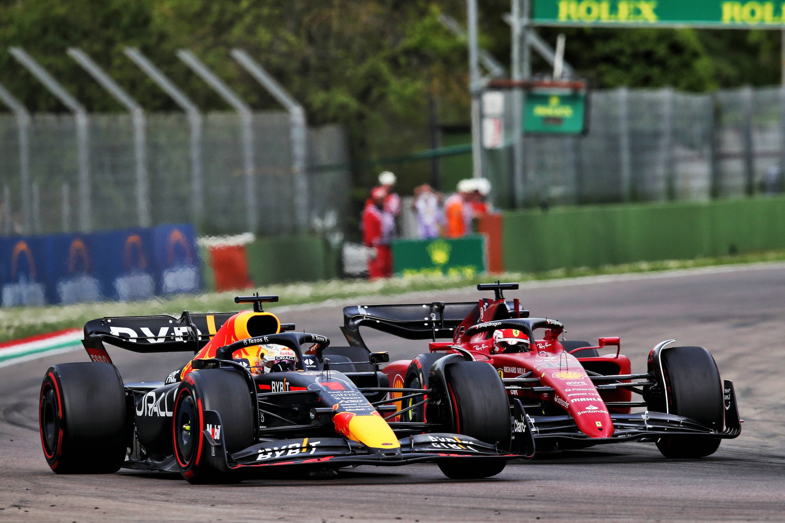 Max Verstappen (NLD) Red Bull Racing RB18 passes Charles Leclerc (MON) Ferrari F1-75 for the lead. Formula 1 World