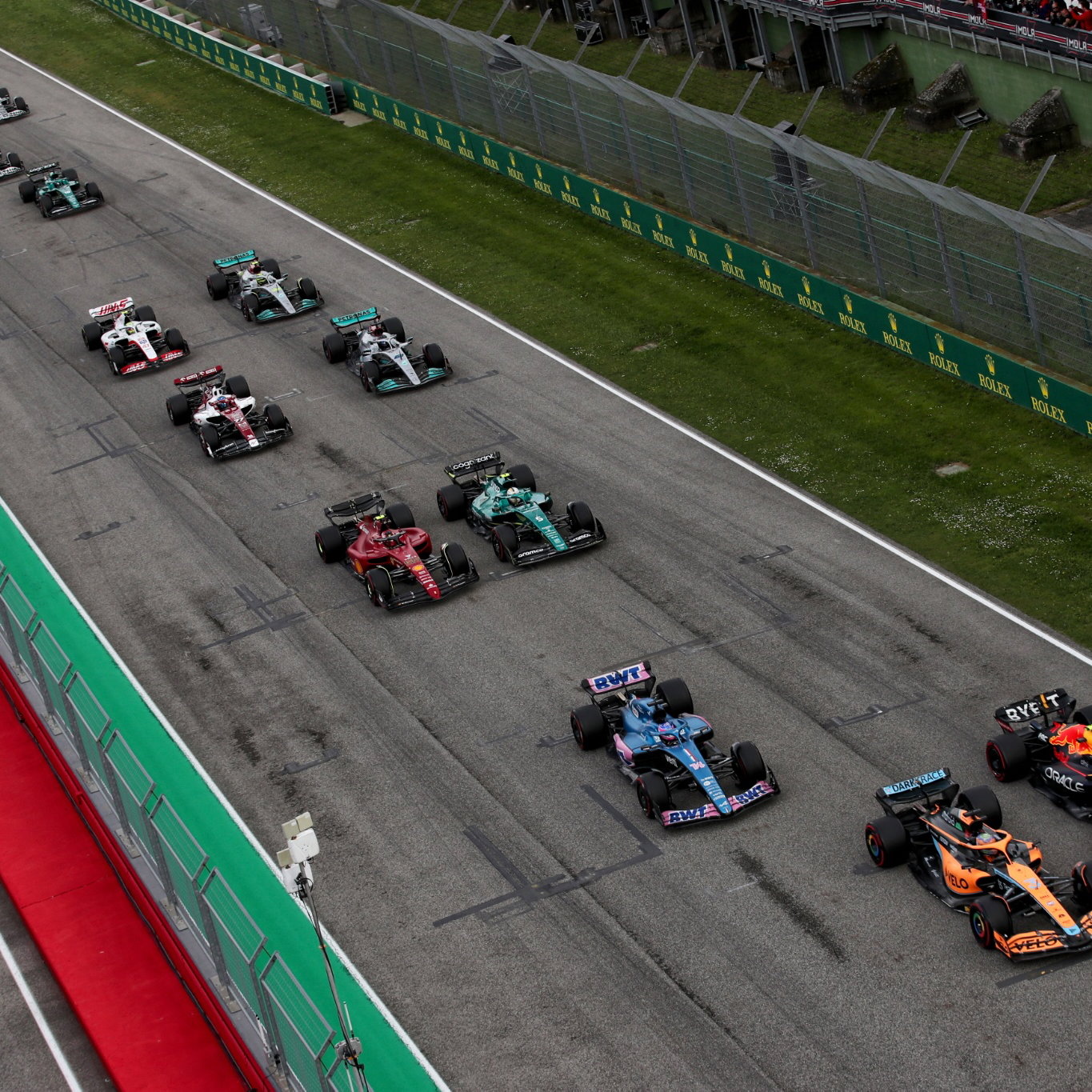 Daniel Ricciardo (AUS) McLaren MCL36 and Sergio Perez (MEX) Red Bull Racing RB18 at the start of the race. Formula 1 World