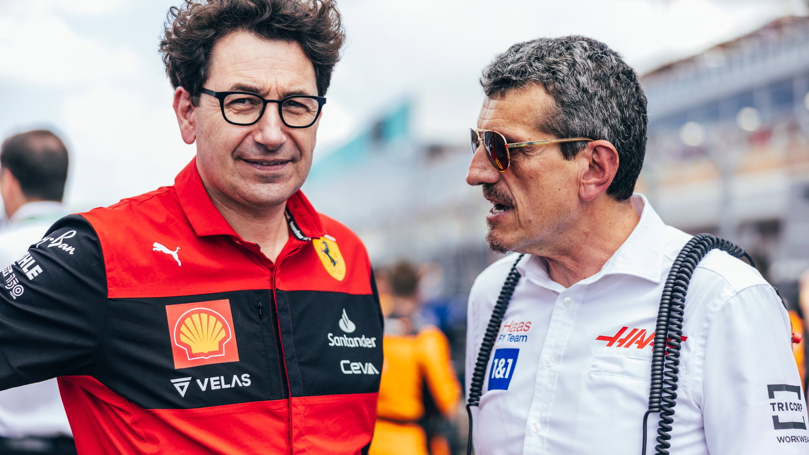 (L to R): Mattia Binotto (ITA) Ferrari Team Principal with Guenther Steiner (ITA) Haas F1 Team Prinicipal on the grid.

