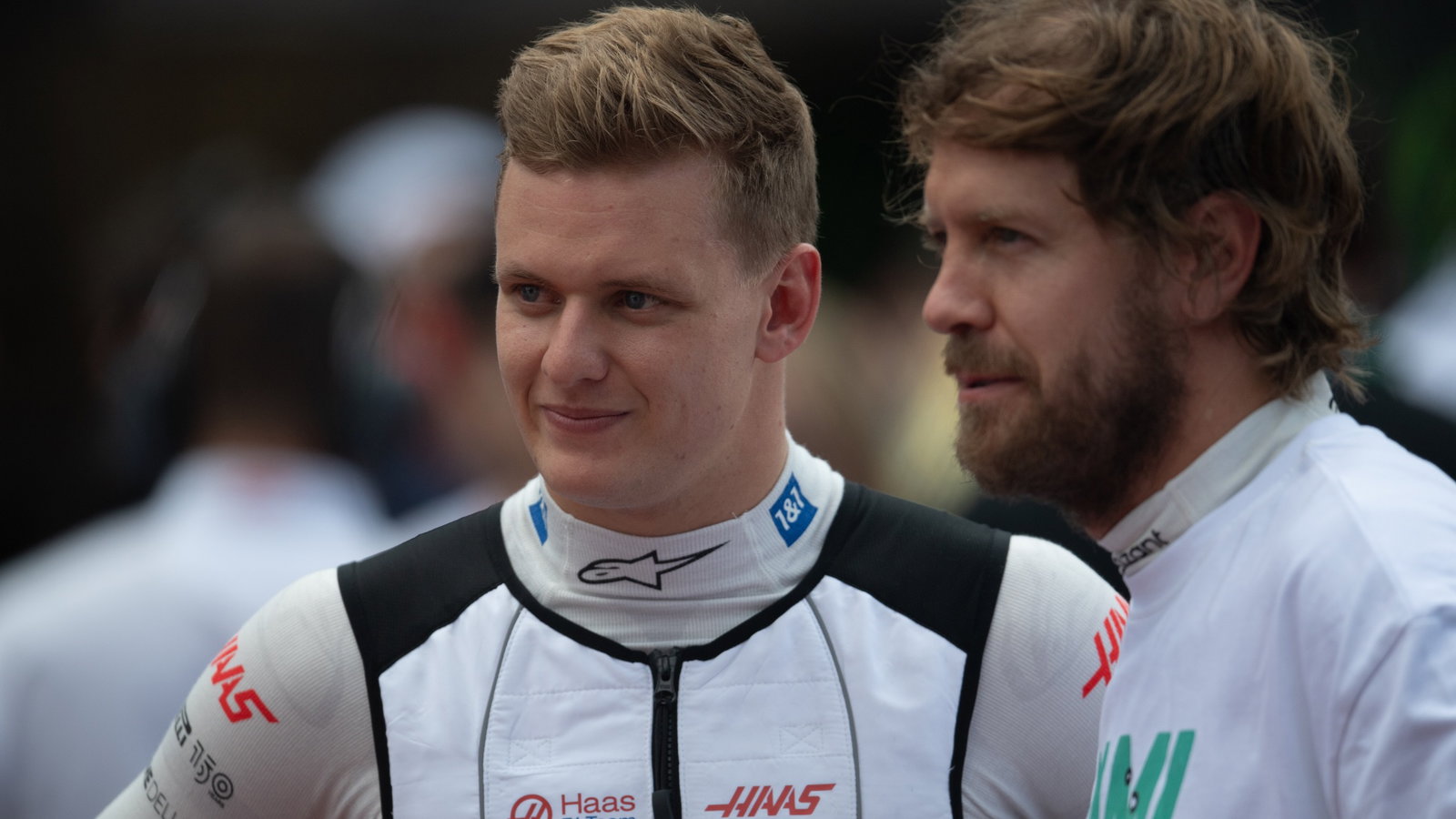 (L to R): Mick Schumacher (GER) Haas F1 Team with Sebastian Vettel (GER) Aston Martin F1 Team on the grid. Formula 1 World